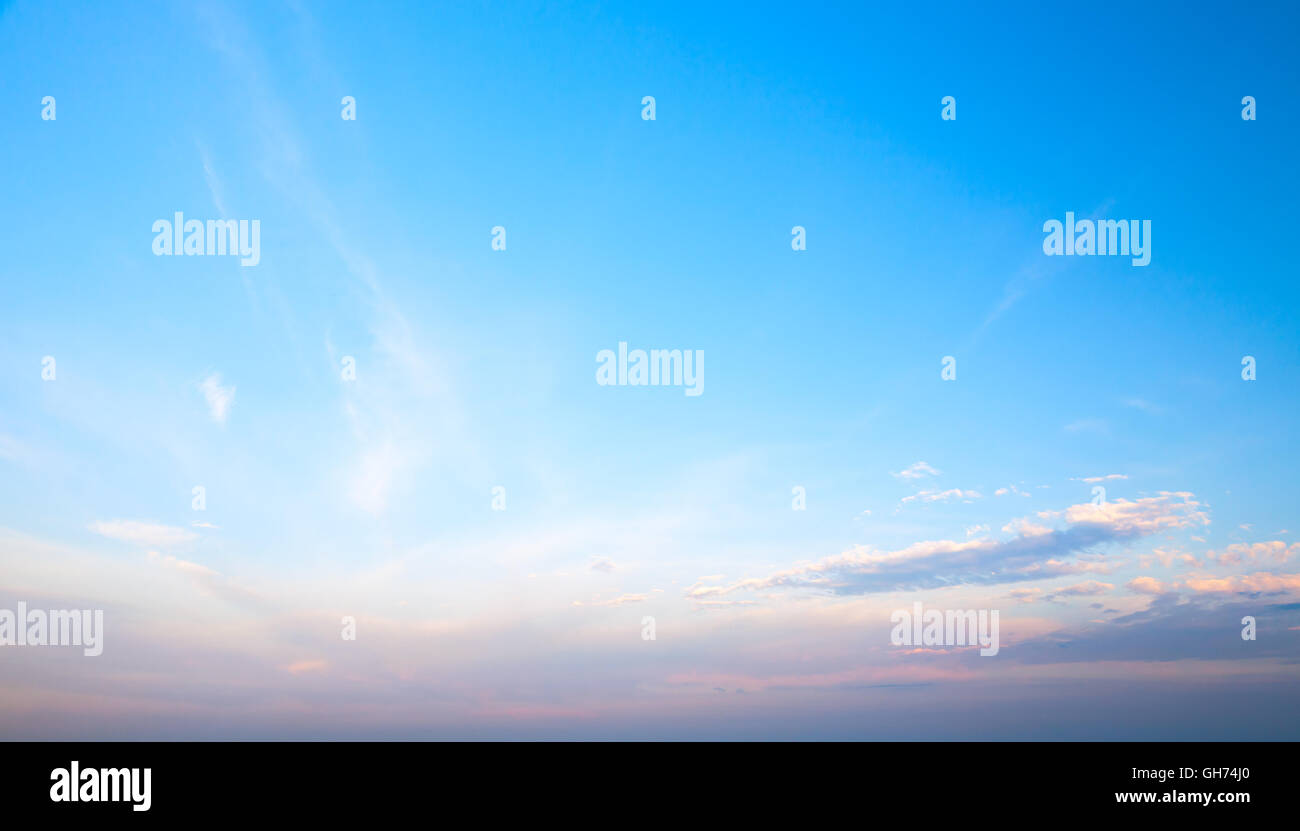 Blue cloudy sky at evening. Natural background photo texture Stock Photo