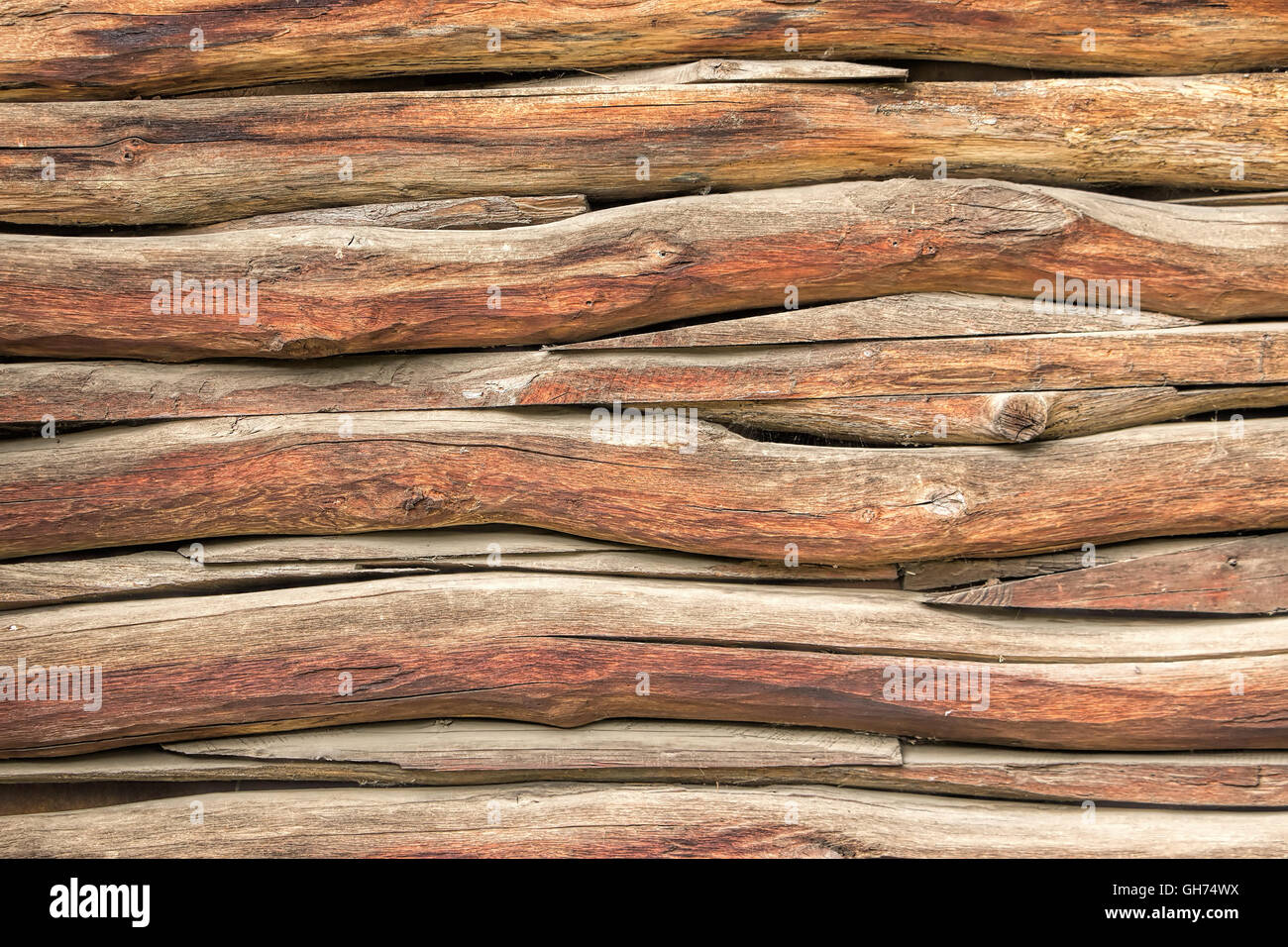 Rustic grunge background, wall of old country house from wooden beams, traditional construction technology. Stock Photo