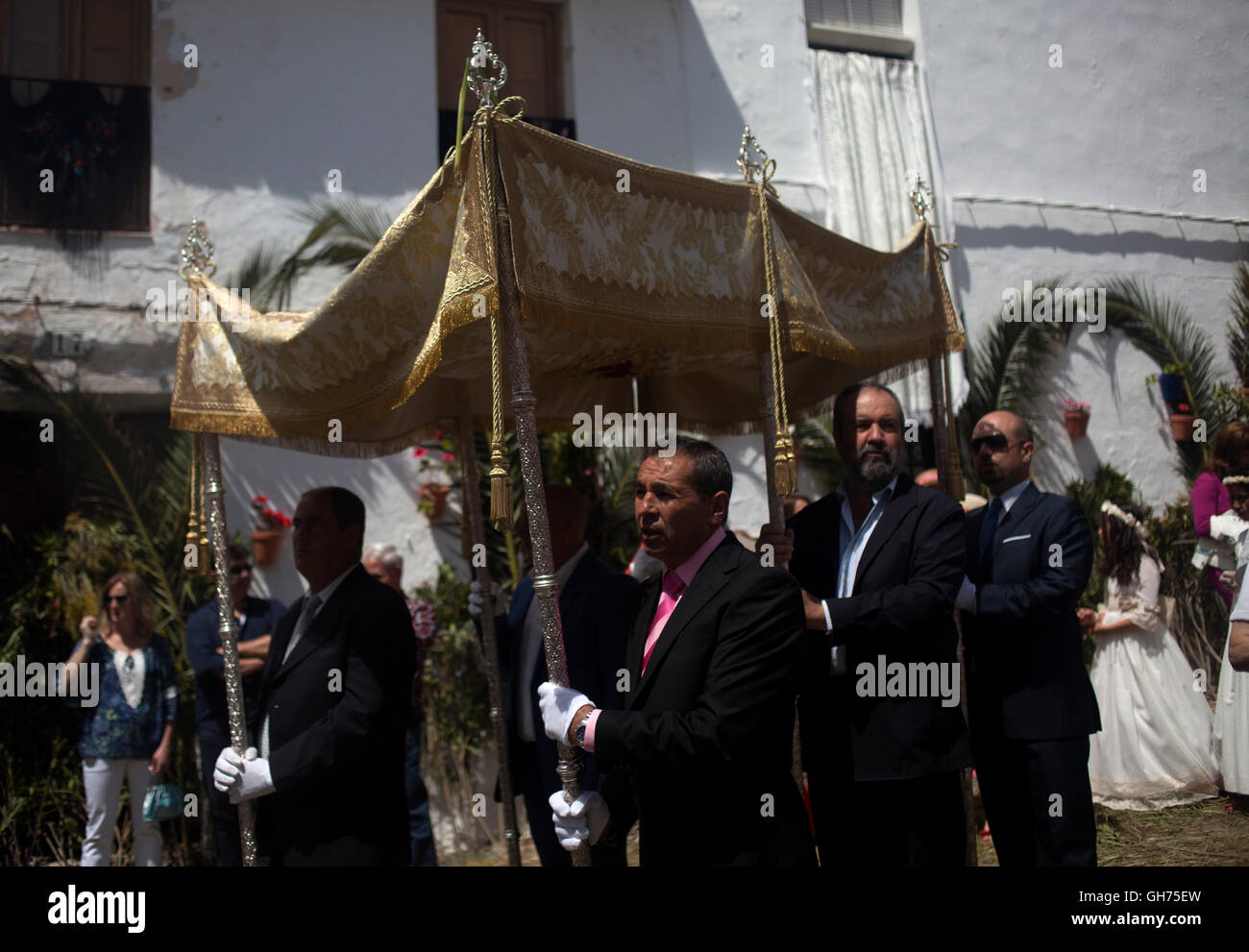 Men hold a parasol during Corpus Christi celebration in El Gastor, Sierra  de Cadiz, Andalusia, Spain Stock Photo - Alamy