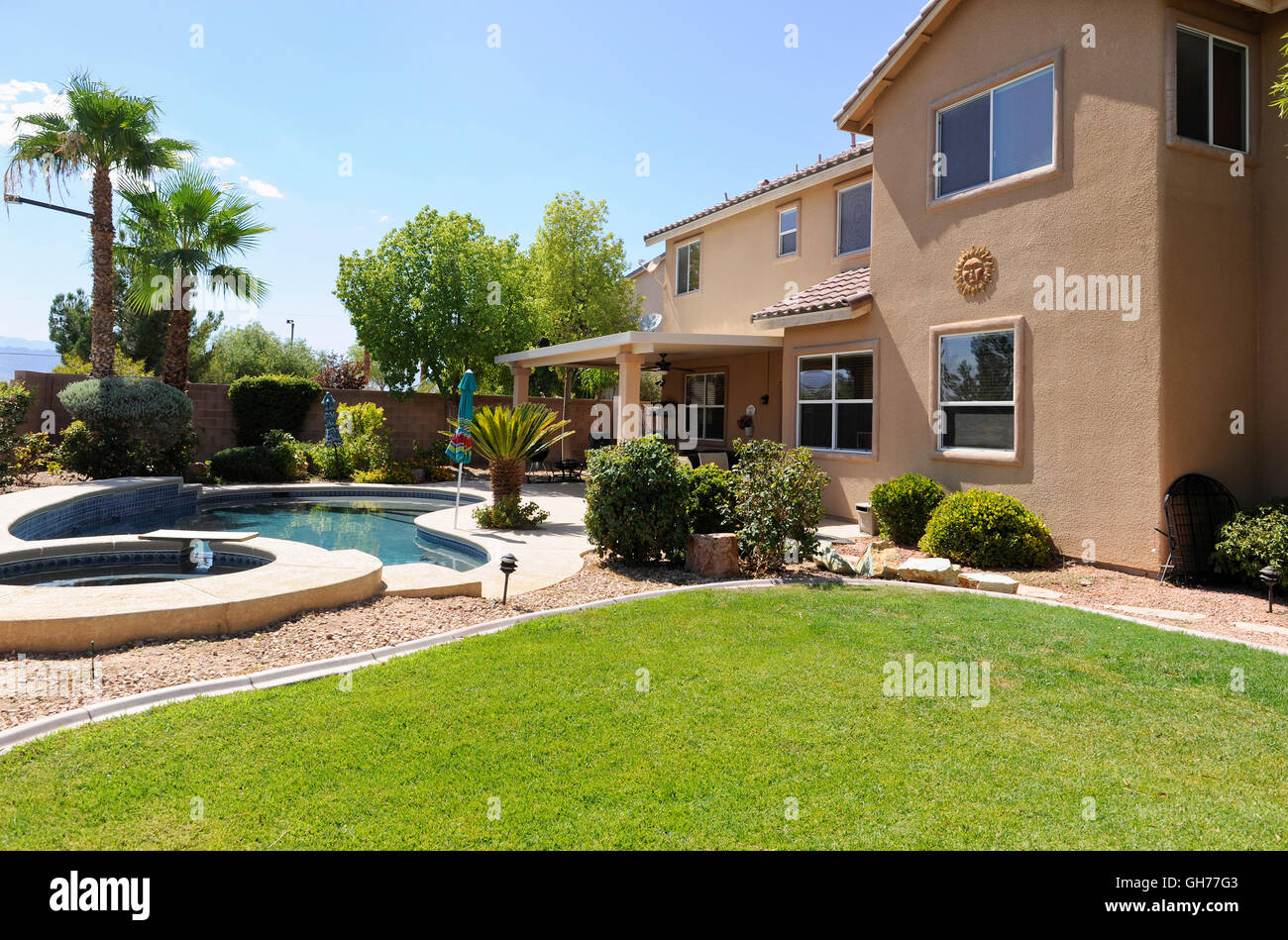 Residential backyard swimming pool in the desert southwest USA Stock Photo