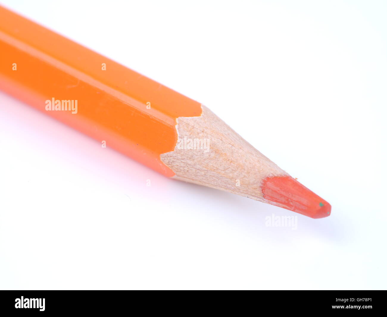 Orange pencil on a white background Stock Photo - Alamy