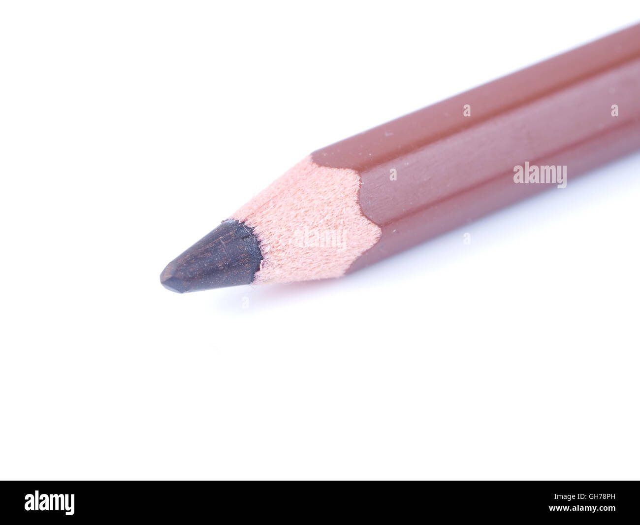 brown pencil on a white background Stock Photo - Alamy