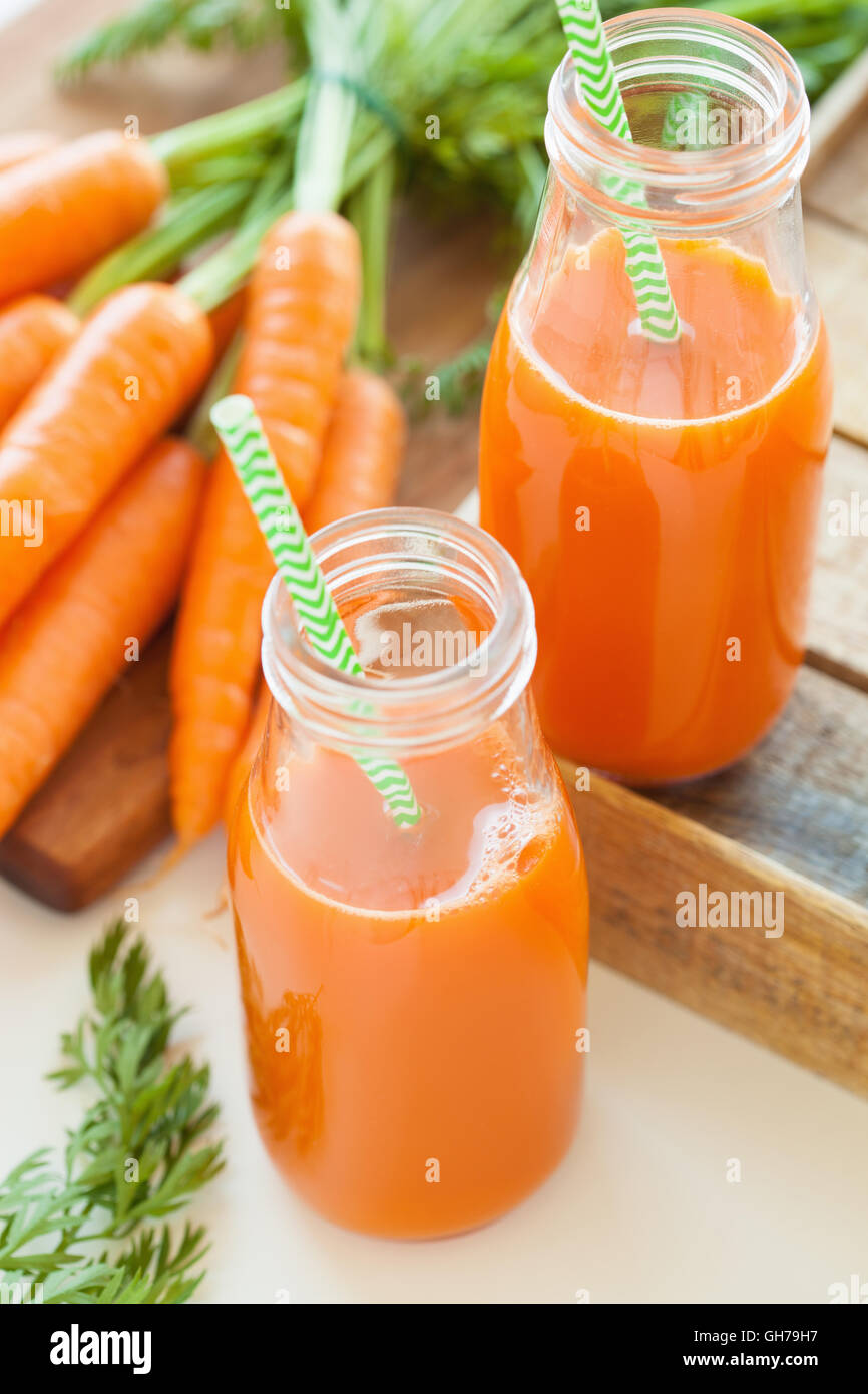 fresh carrot juice and vegetables Stock Photo Alamy