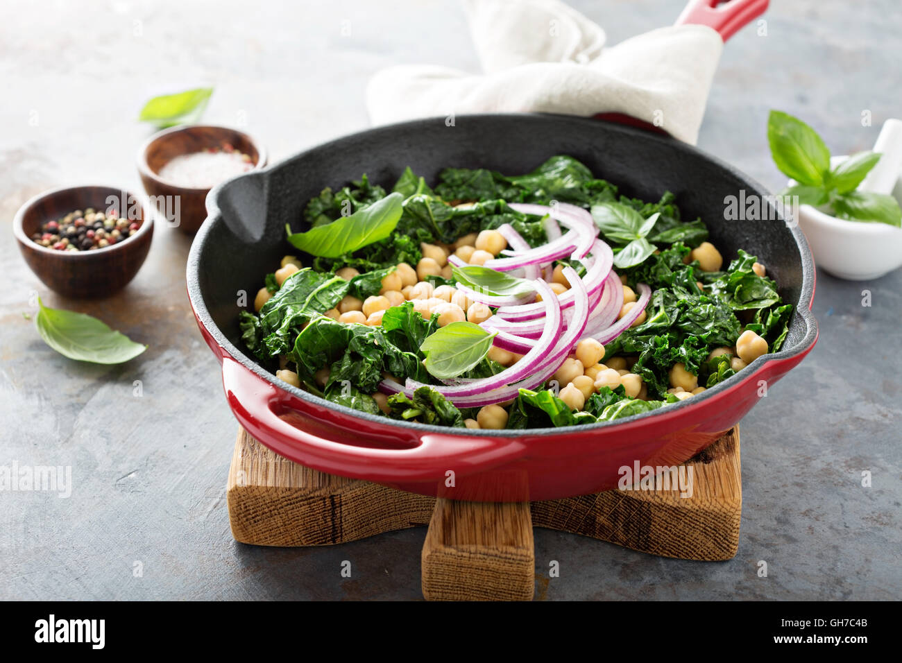 Sauteed kale with chickpeas and red onion Stock Photo Alamy