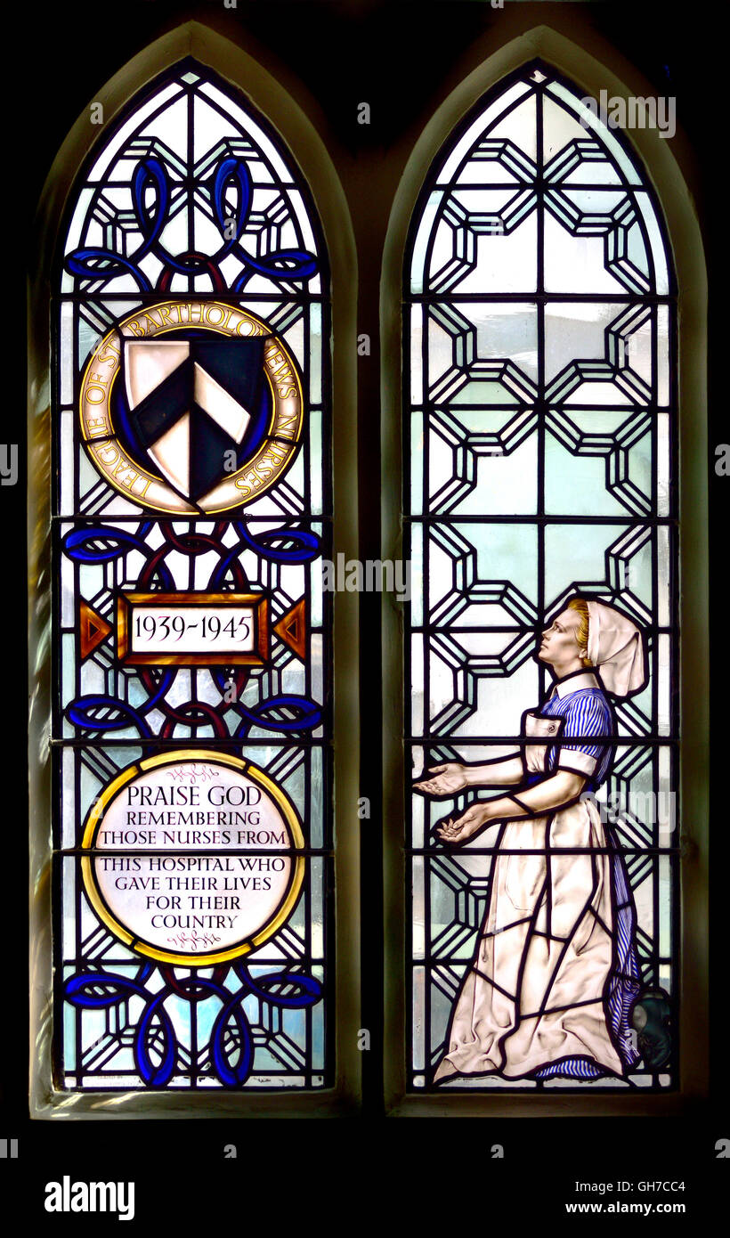 London England, UK. Church of St Bartholomew the Less. Stained glass window remembering the nurses of Bart's Hospital who died.. Stock Photo