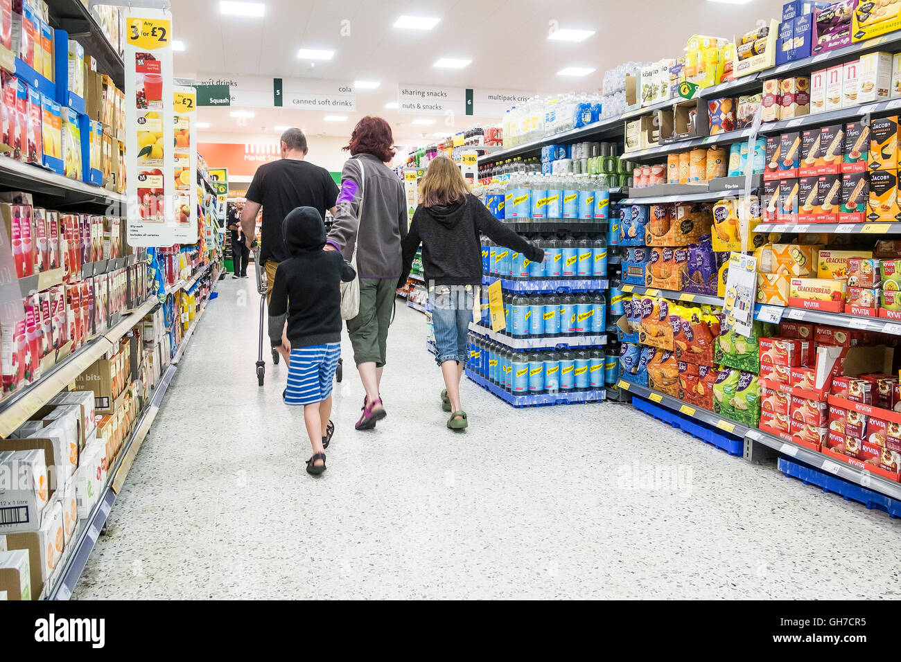 Customers shopping in a Morrisons supermarket. Stock Photo