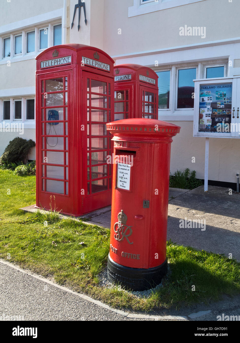 Traditional British mail boxes and telephone kiosks outside the post