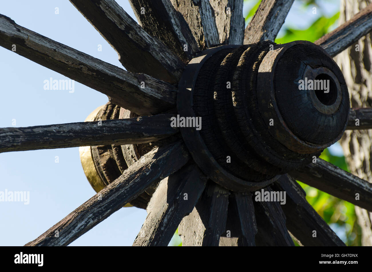 Silhouette antique wagon wheel For travel in antiquity, Thailand Stock Photo