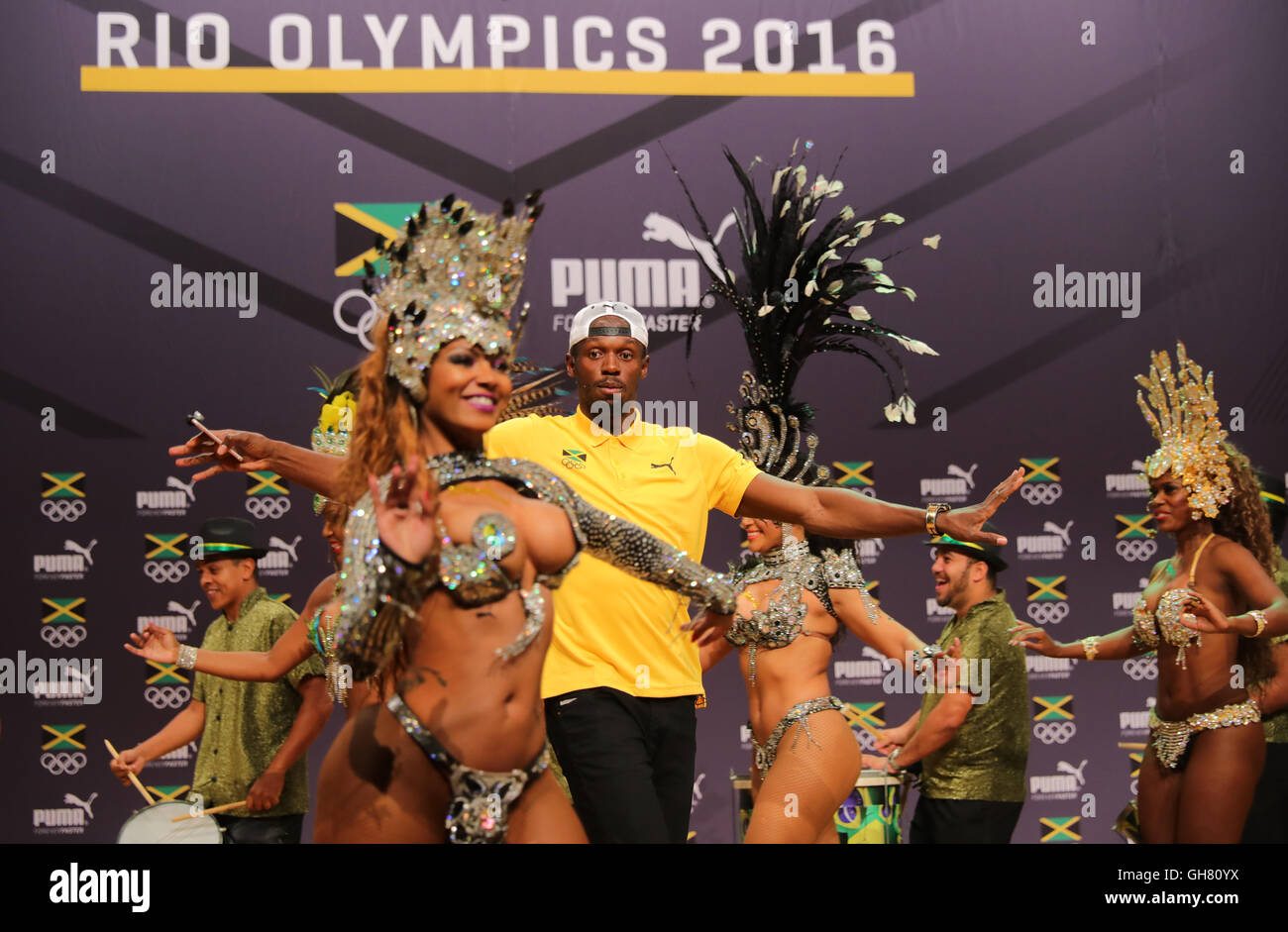 Rio de Janeiro, Brazil. 8th Aug, 2016. Athlete Usain Bolt of Jamaica dances  with Samba dancers during a press conference of the Jamaican Olympic  Association and PUMA in Barra during the Rio