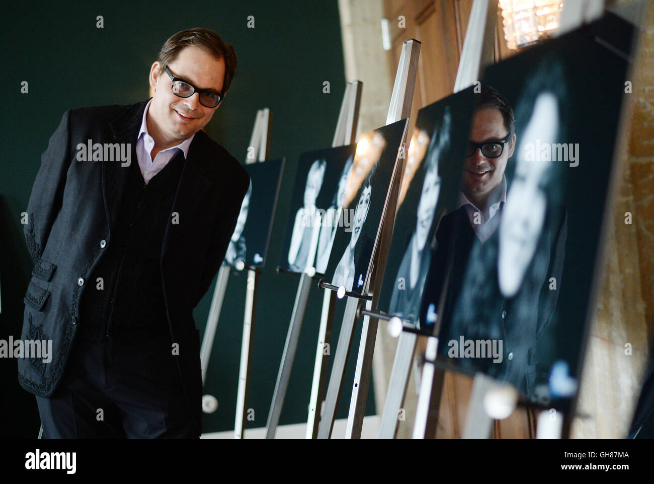 Berlin, Germany. 9th Aug, 2016. Photographer Peter Badge poses in his