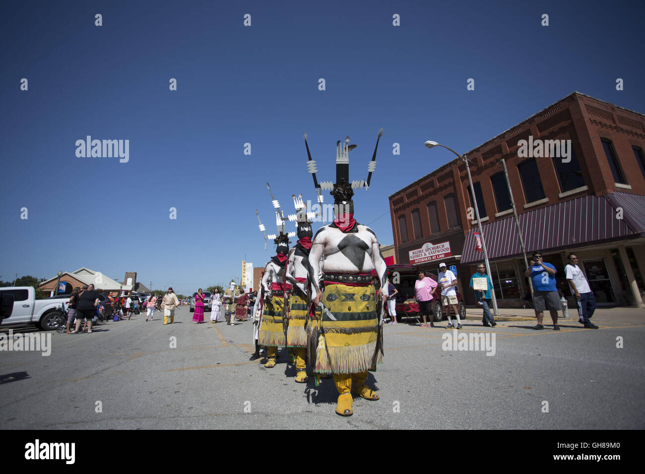 Anadarko, Oklahoma, USA. 8th Nov, 2016. The Fort Sill Apache fire dancers march during the annual American Indian Expo parade in Anadarko, Oklahoma.The annual American Indian Expo showcases the arts, crafts and traditions of 13 plains Indian tribes. The expo features The Chiricahua Apaches, commonly known as the Fort Sill Apache Fire Dancers. They perform the ''Dance of the Mountain Spirit'', which has been passed down to the Gooday family from generations of ancestors. The dance is said to drive away sickness and evil and bring good health and fortune. (Credit Image: © J Pat Carter via Stock Photo
