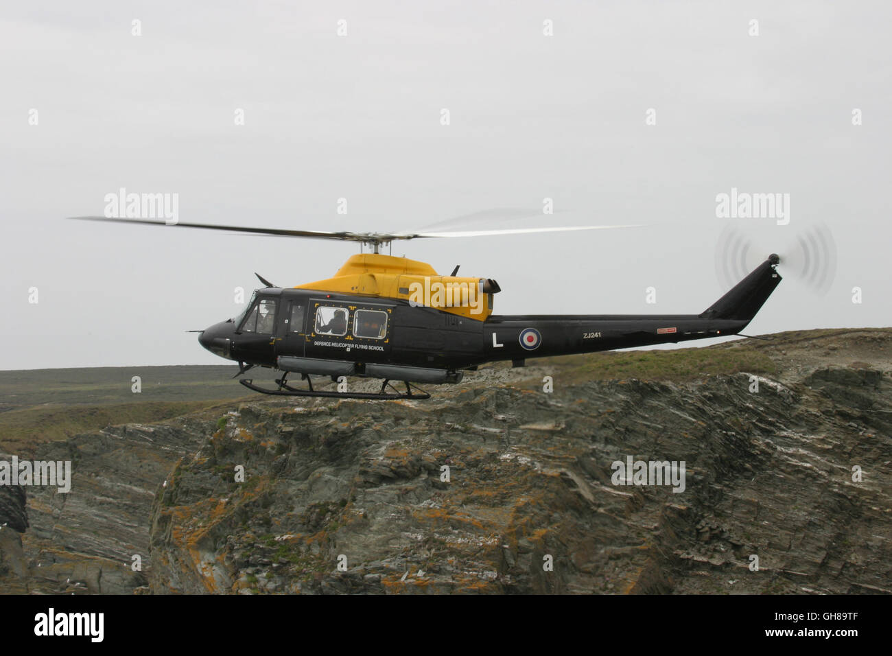 FILE PIC: North Wales, UK, 9th Aug 2016, Royal Air Force Bell412 Griffin HT1 helicopter registration ZJ241 made a precautionary landing at Yr Aran in Snowdonia this afternoon following a technical issue. All occupants of the aircraft exited safely before the aircraft caught fire and burnt out. Photo shows ZJ241 operating from RAF Valley off the coast of Anglesey North Wales in June 2005. Credit:  Paul Bunch/Alamy Live News Stock Photo