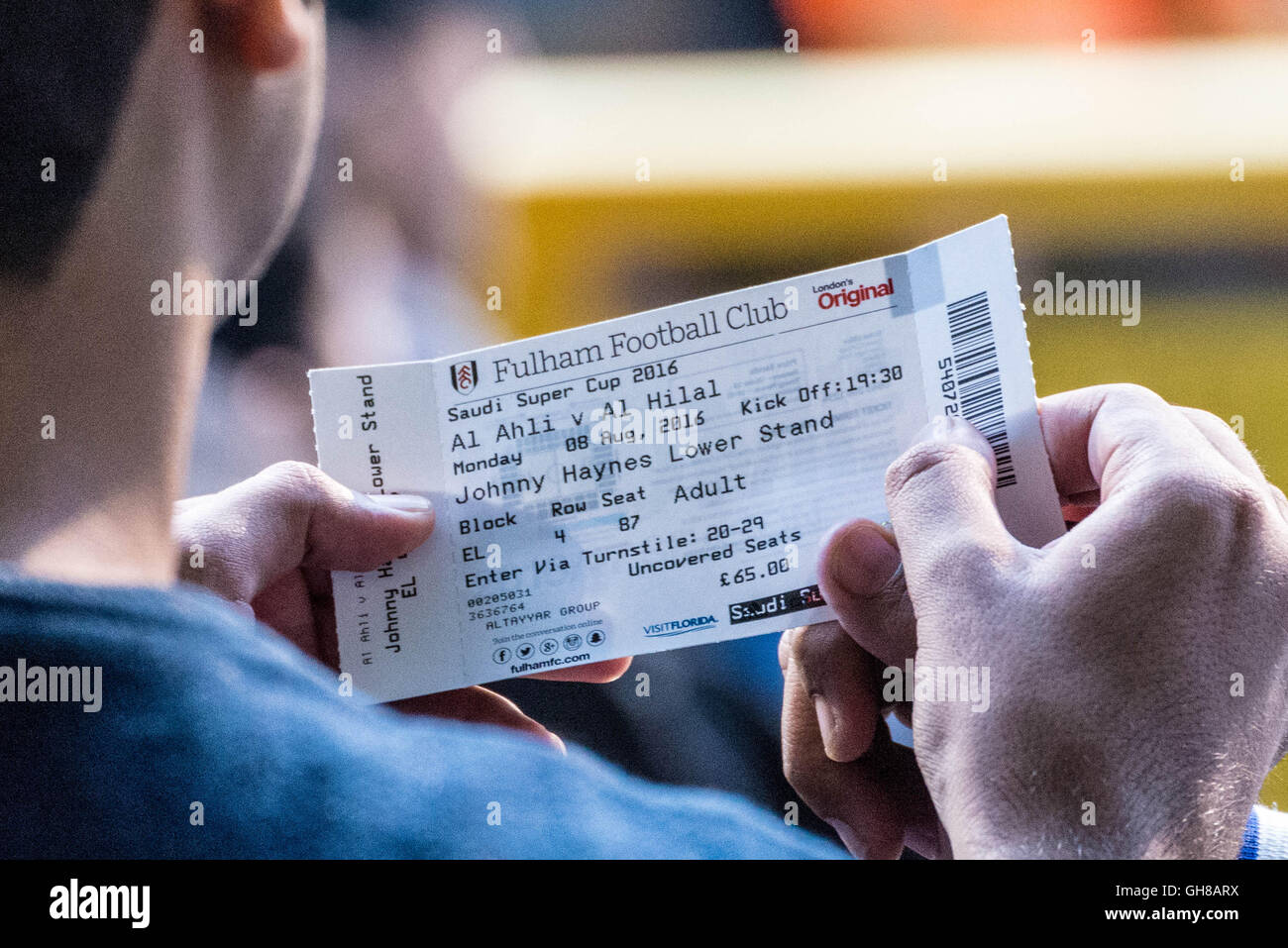 London, UK. 8th August, 2016. Football ticket. Saudis and other middle-eastern fans watch teams Al-Ahli vs Al-Hilal during the Saudi Super Cup match finals at Craven Cottage, Fulham Football Club Credit:  Guy Corbishley/Alamy Live News Stock Photo