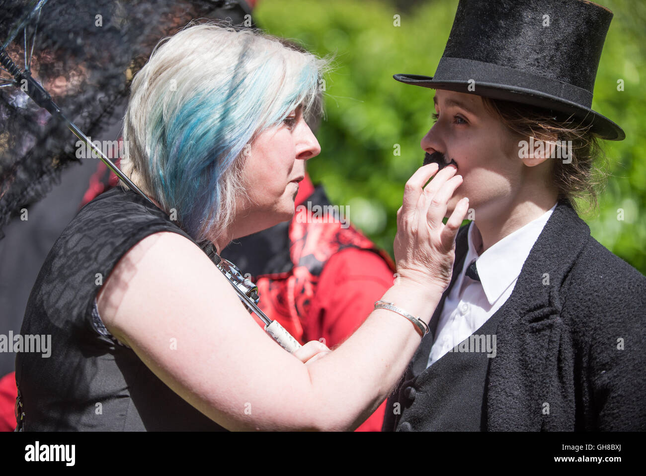 Woman checking a false mustache at the facial hair competition of papplewick pumping stations steam punk event Stock Photo