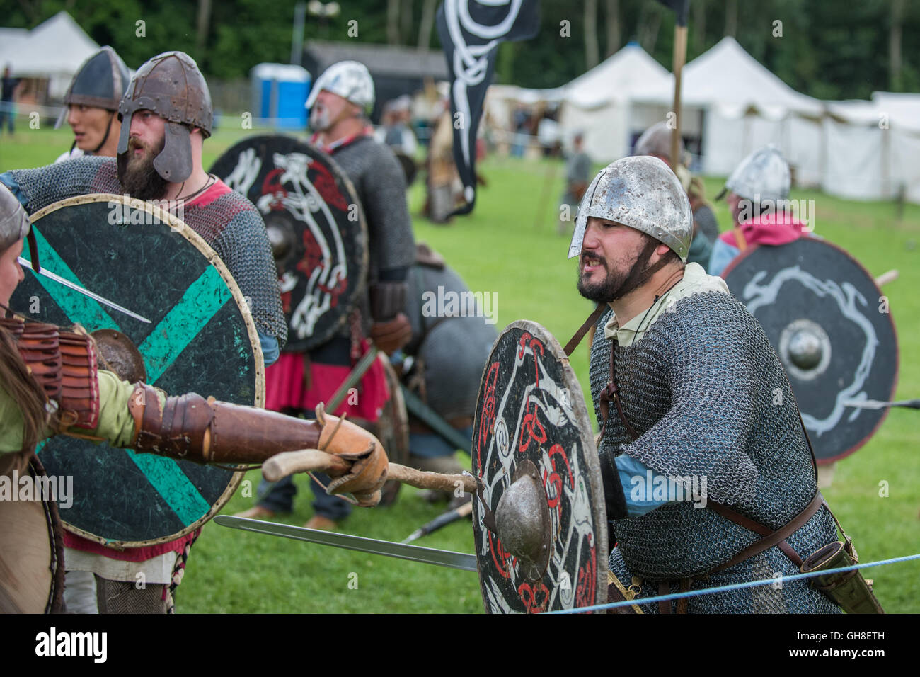 Viking battle re-enactment. Axe striking shield Stock Photo - Alamy