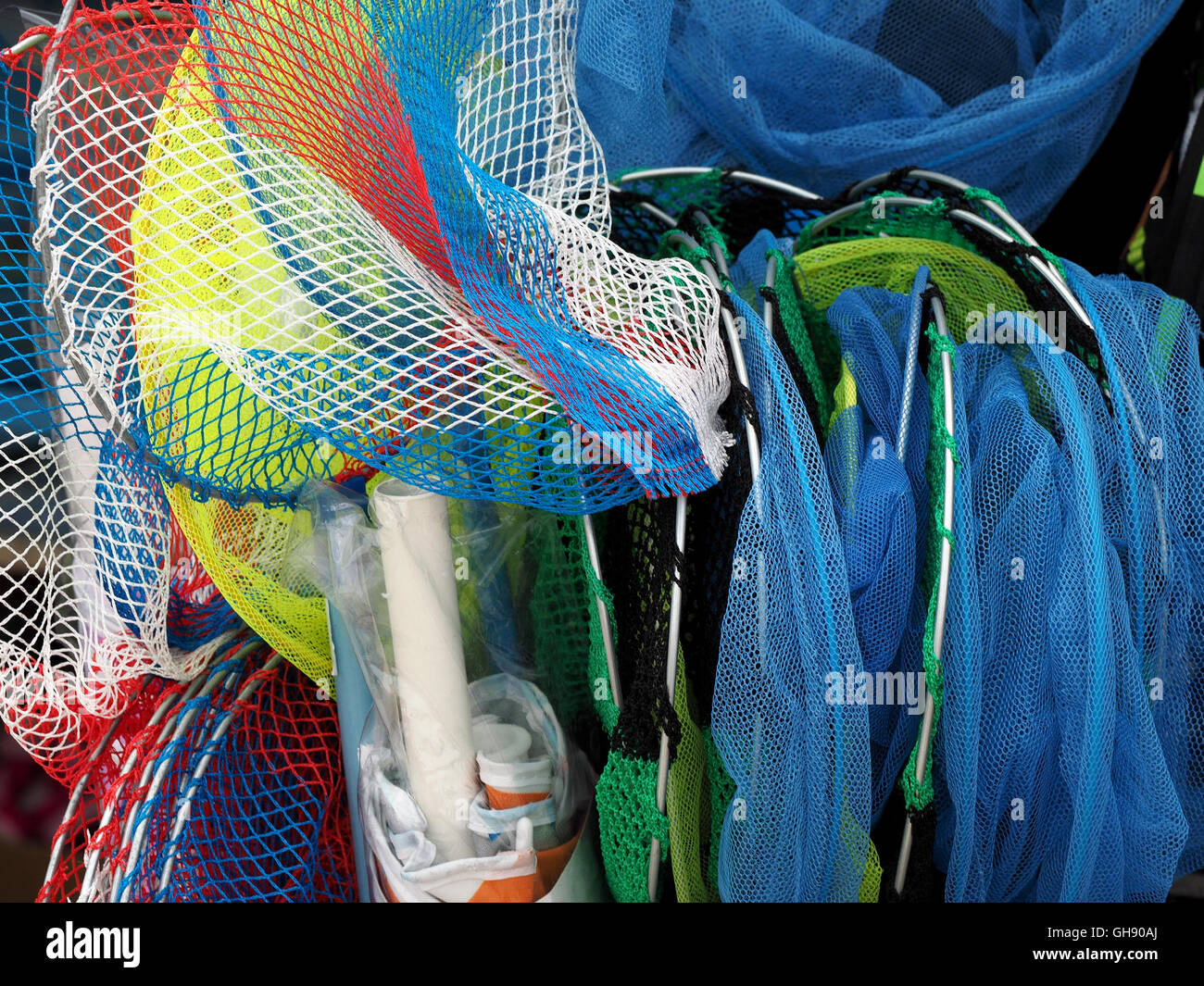 Colourful fishing nets displayed for sale at a seaside resort Stock