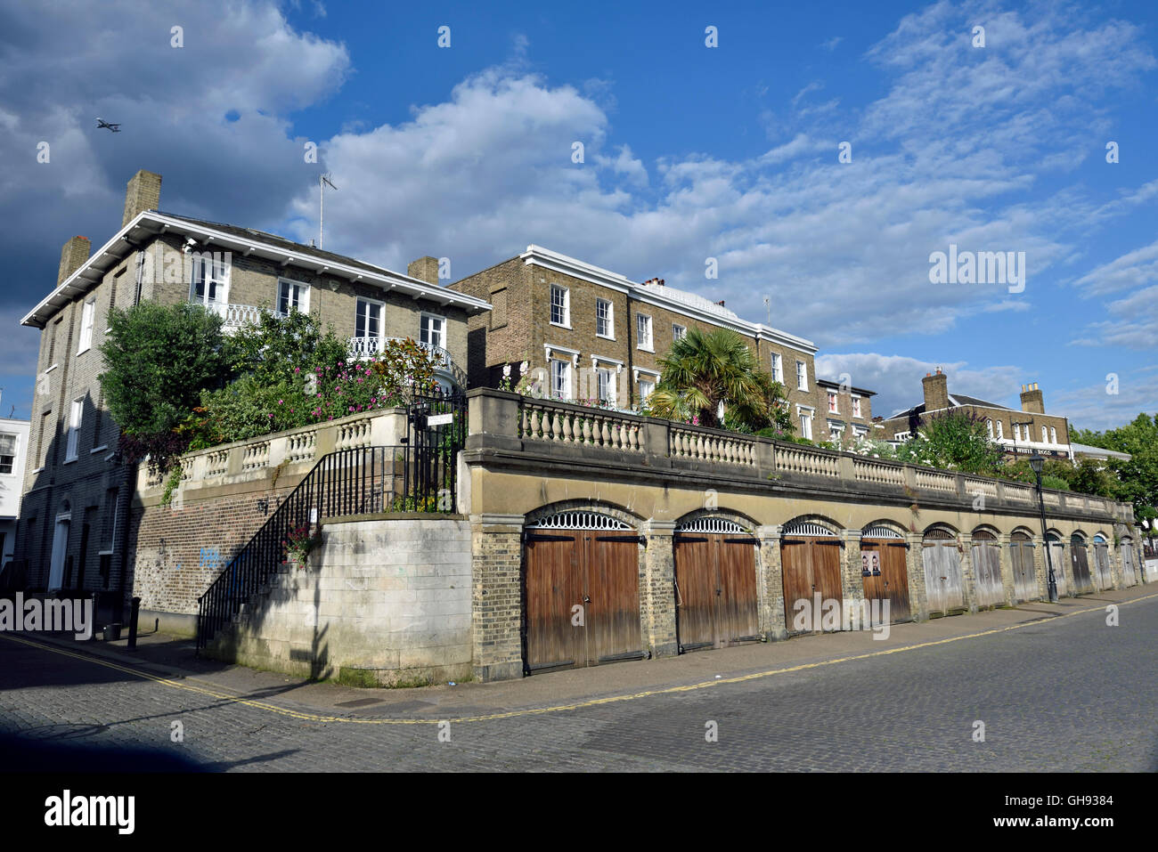 St. Helena Terrace, listed period houses with boat houses below, Richmond Riverside Surrey England Britain UK Stock Photo