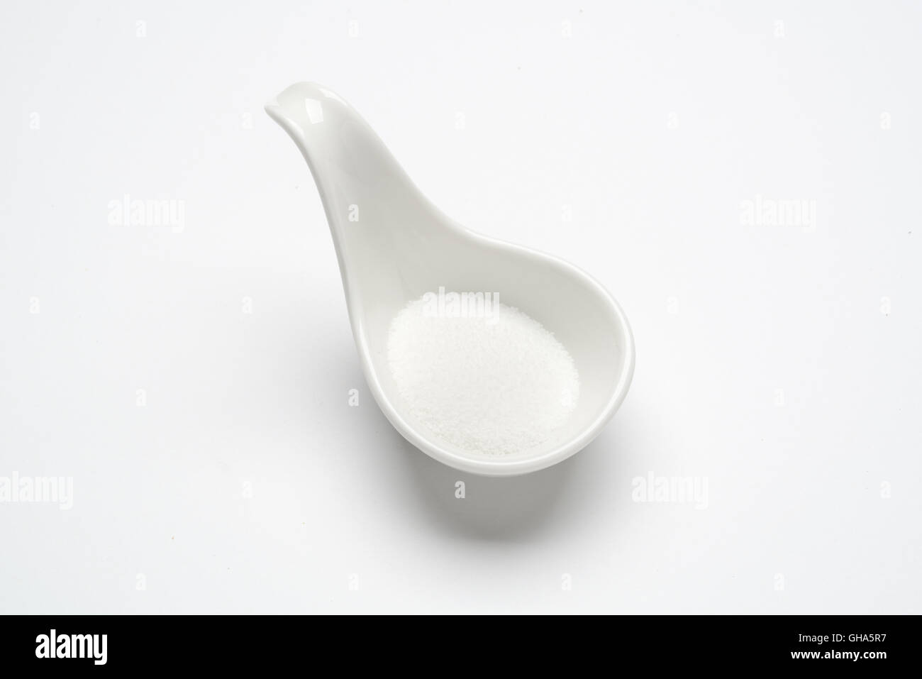 https://c8.alamy.com/comp/GHA5R7/monotone-sugar-1-tablespoon-in-a-white-spoon-on-the-white-background-GHA5R7.jpg