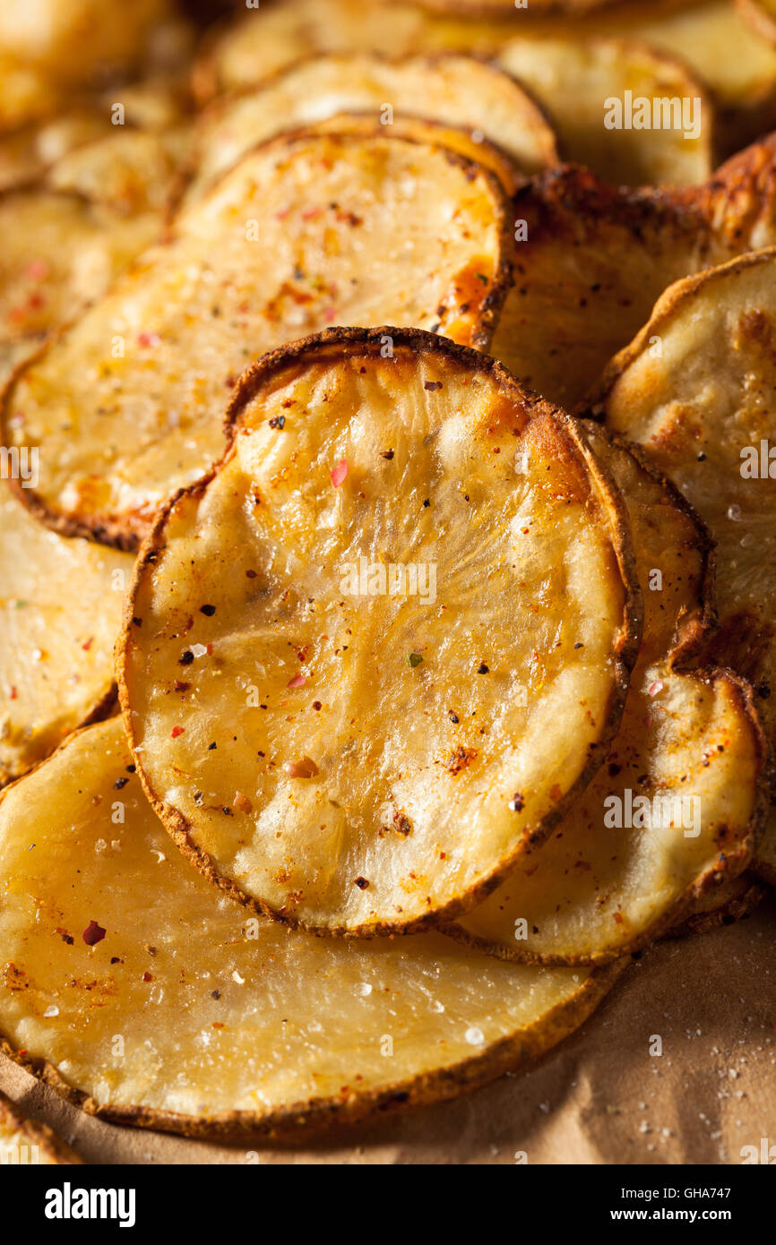 Homemade Spicy LIme and Pepper Baked Potato Chips with Herbs Stock