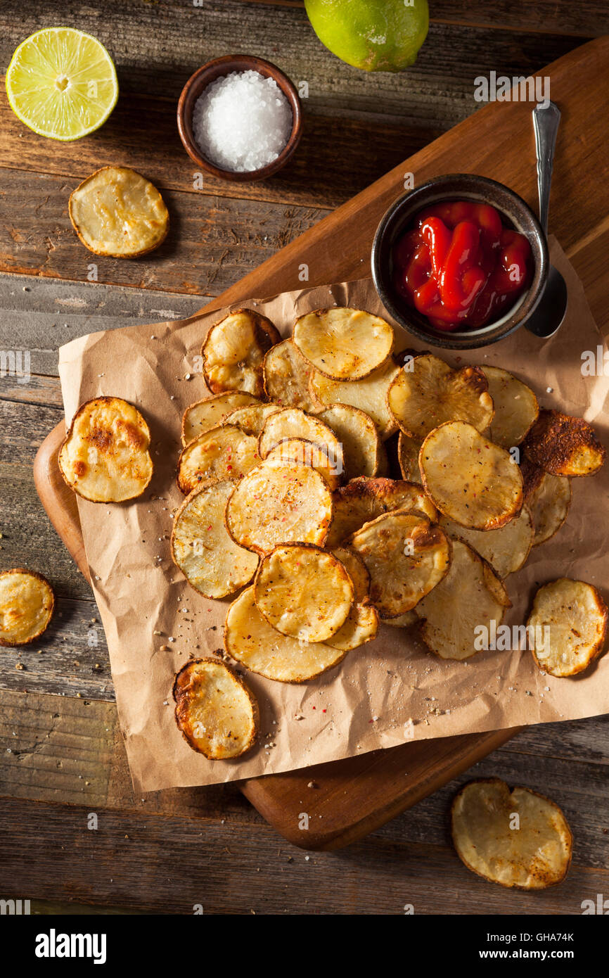 Homemade Spicy LIme and Pepper Baked Potato Chips with Herbs Stock