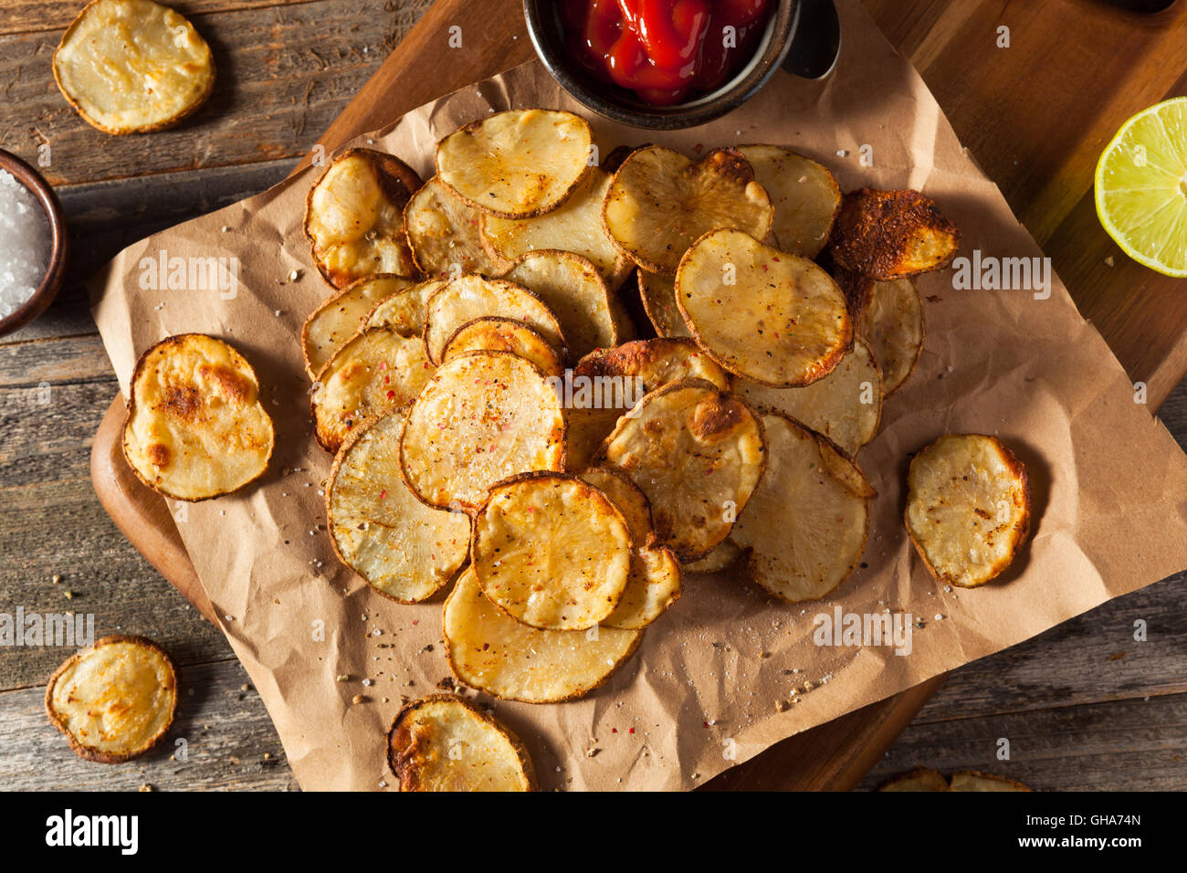 Homemade Spicy LIme and Pepper Baked Potato Chips with Herbs Stock