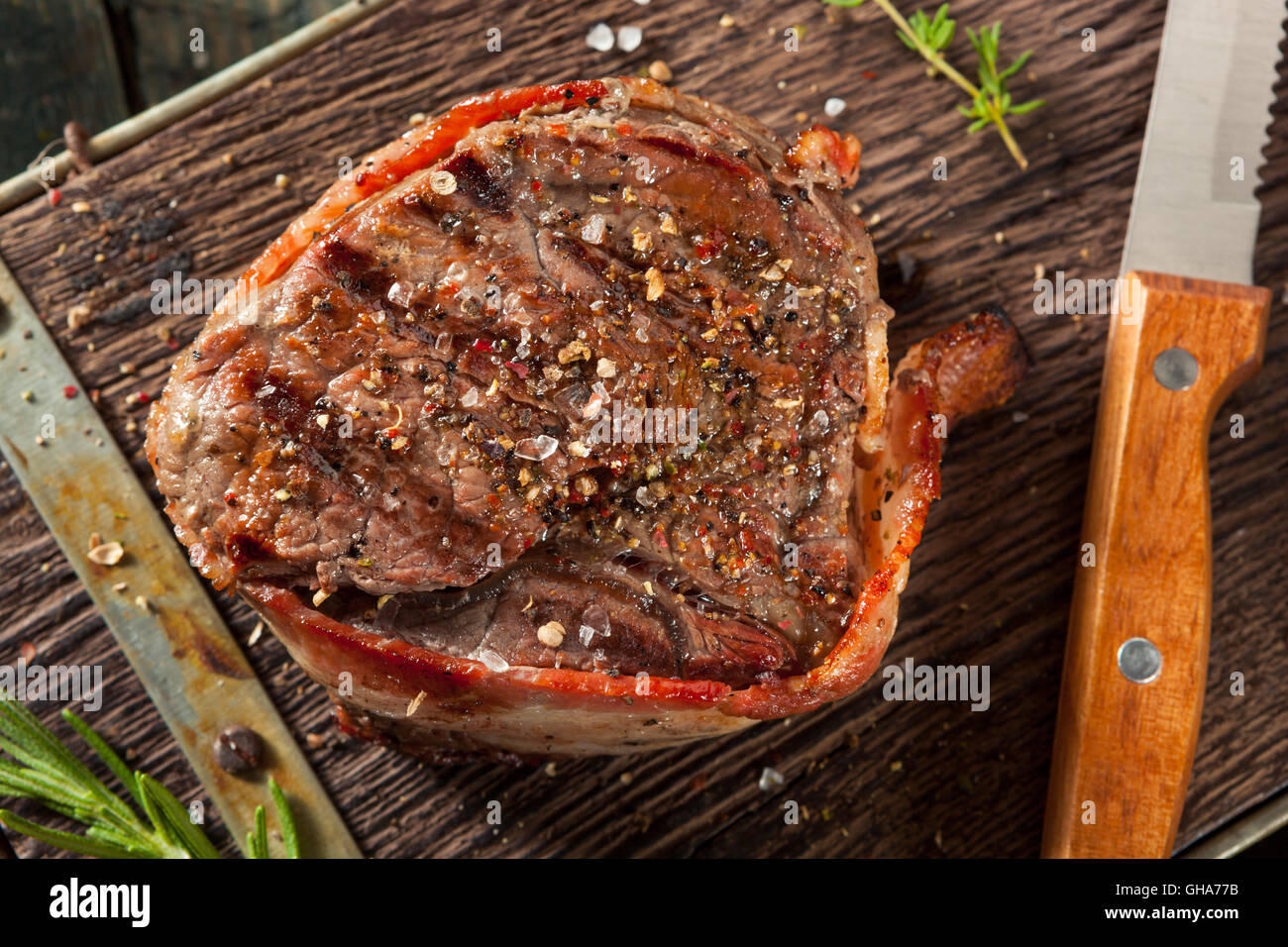 Organic Grass Fed Bacon Wrapped Sirloin Steak with Herbs Stock Photo
