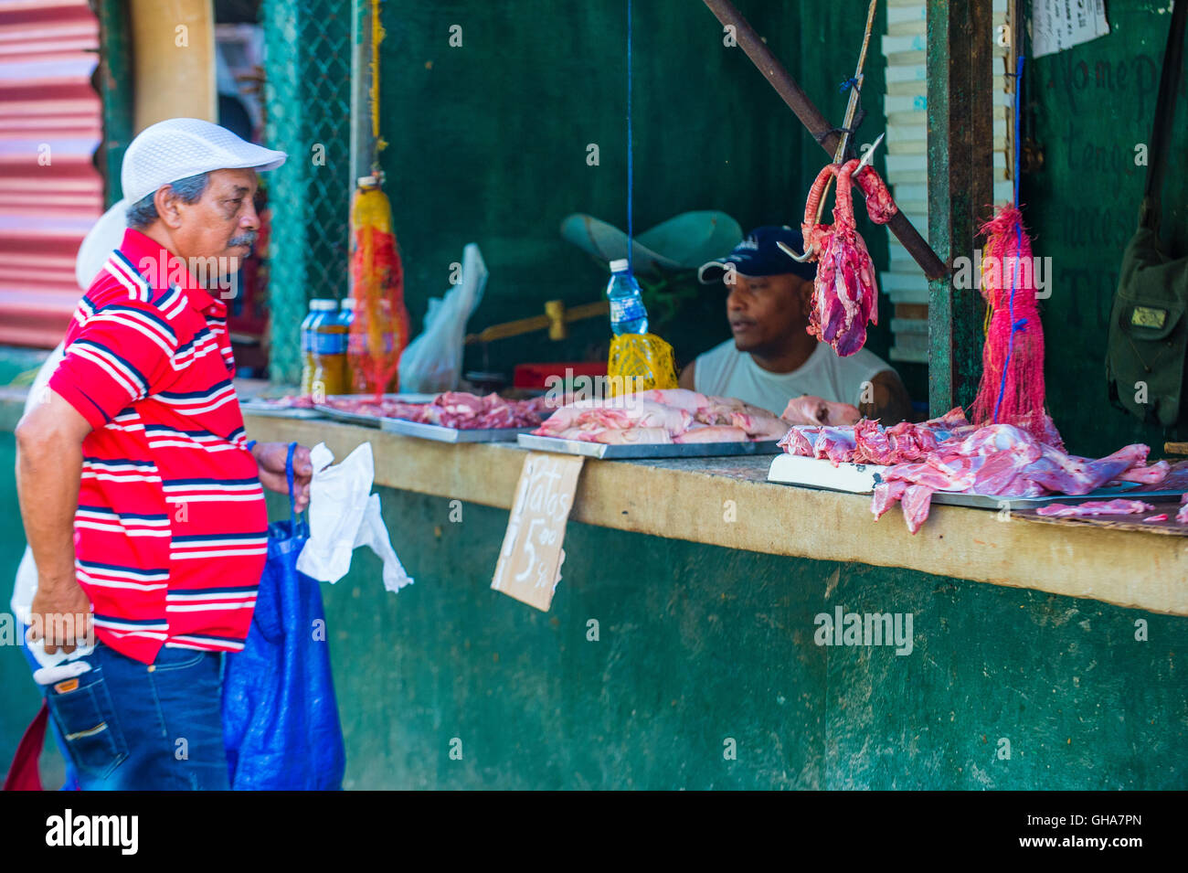 A Cuban meat seller in old Havana street Stock Photo Alamy
