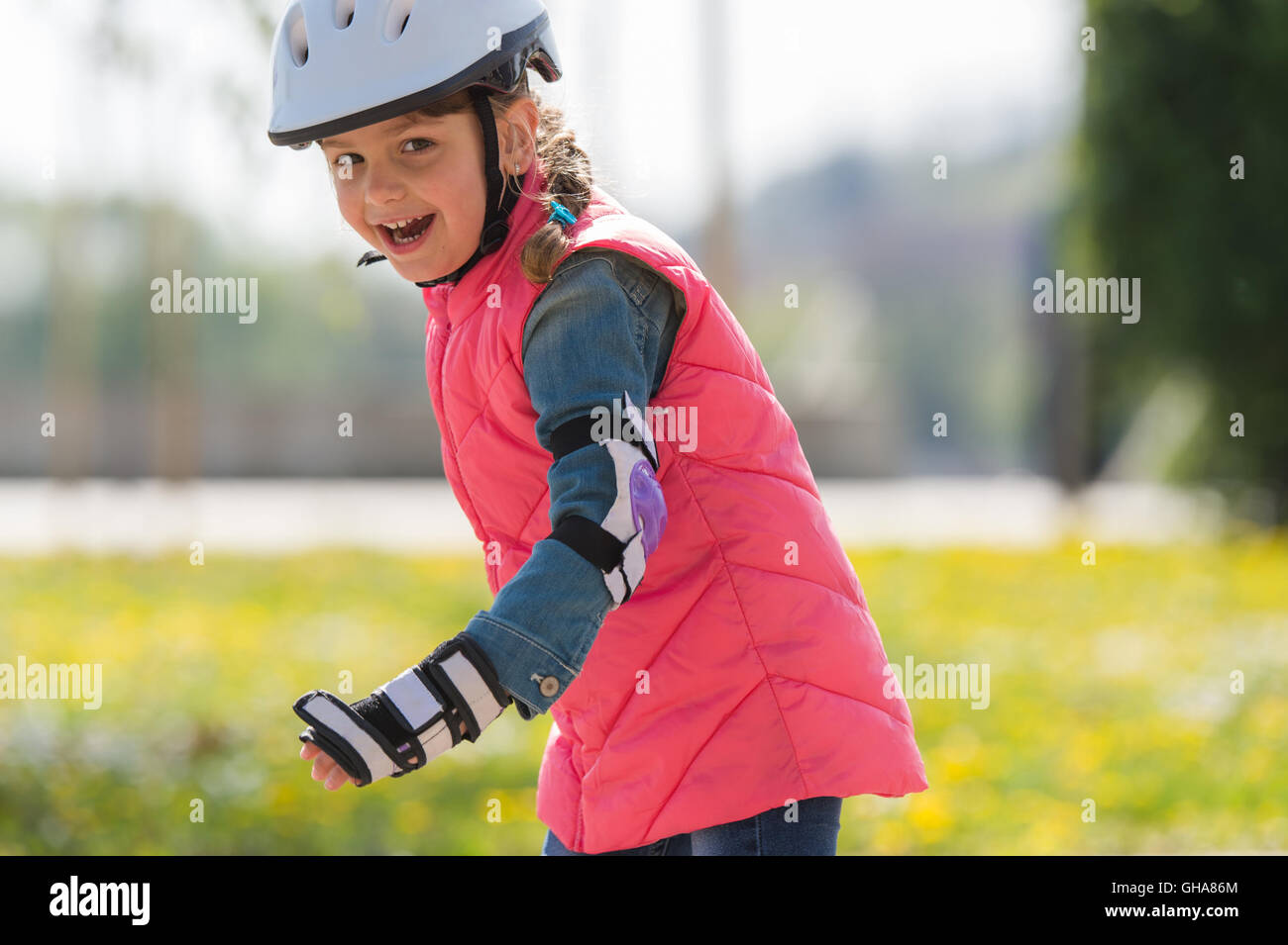 girl on roller skates in park Stock Photo