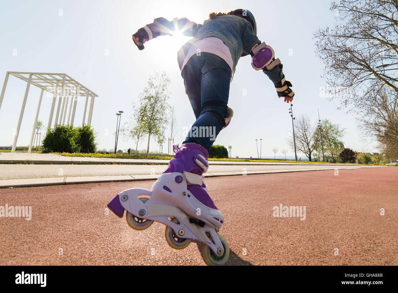 girl on roller skates in park Stock Photo
