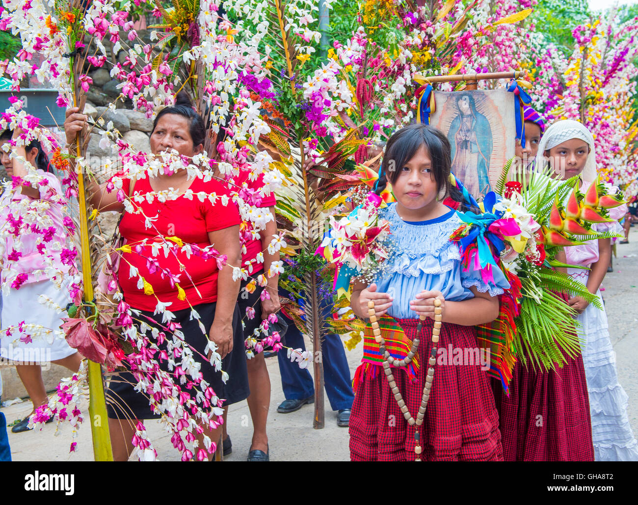 Salvadorian women participate in the procession of the Flower & Palm Festival in Panchimalco, El Salvador Stock Photo