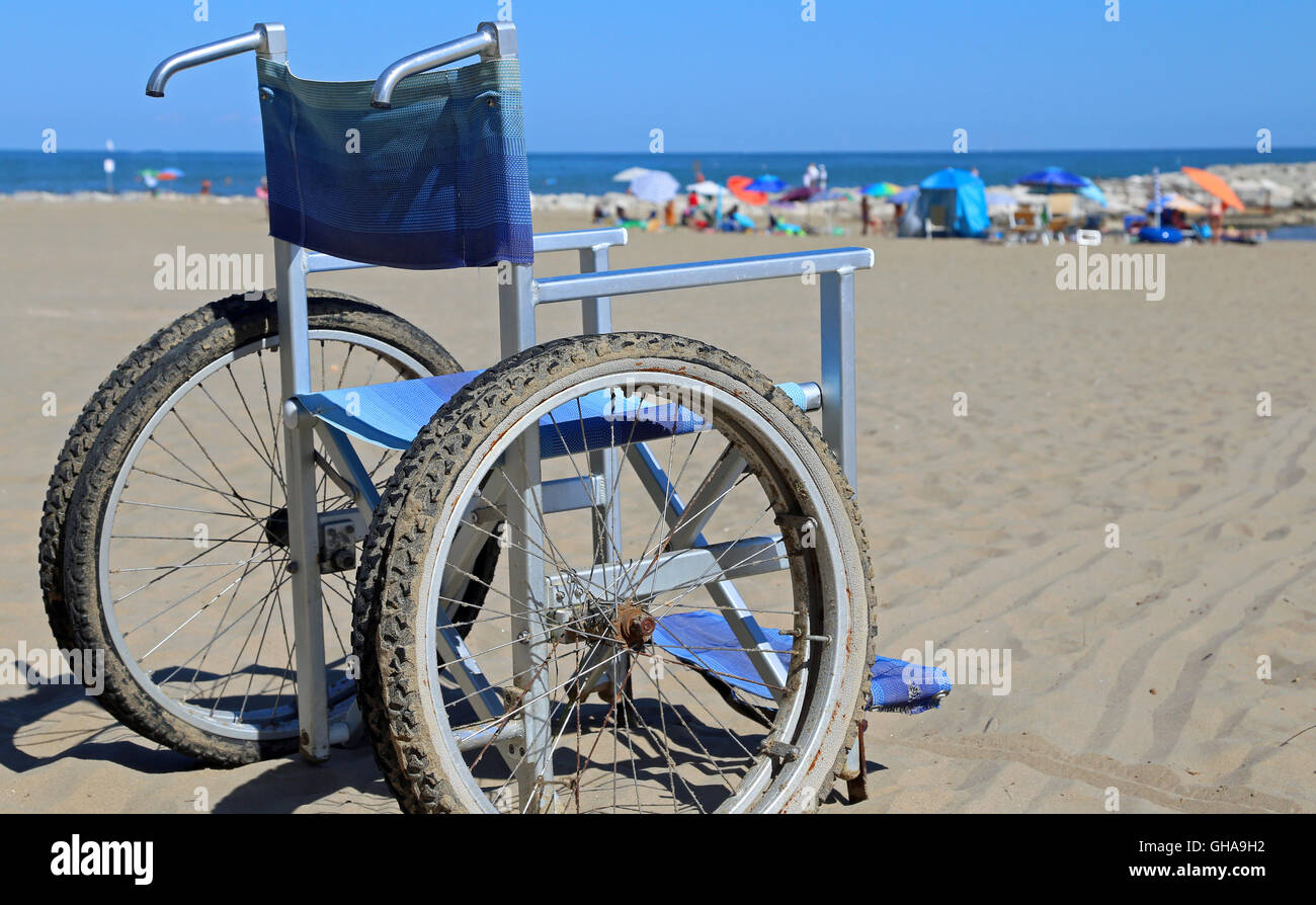 Wheelchair on the beach sand near the sea Stock Photo Alamy