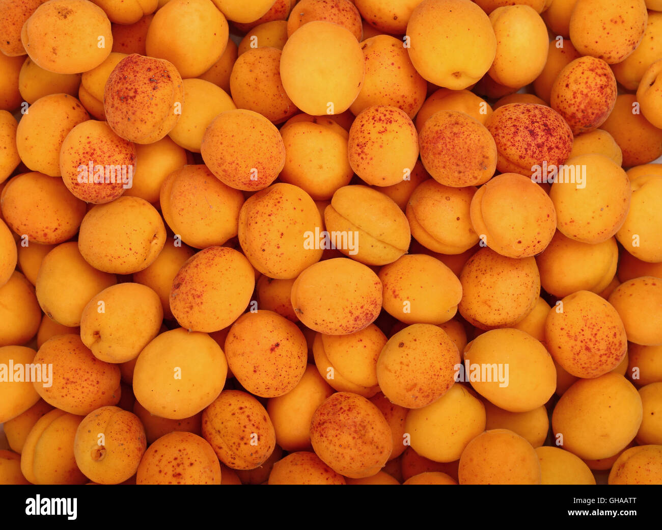 Fresh ripe mellow apricots background pattern close up, top view Stock Photo