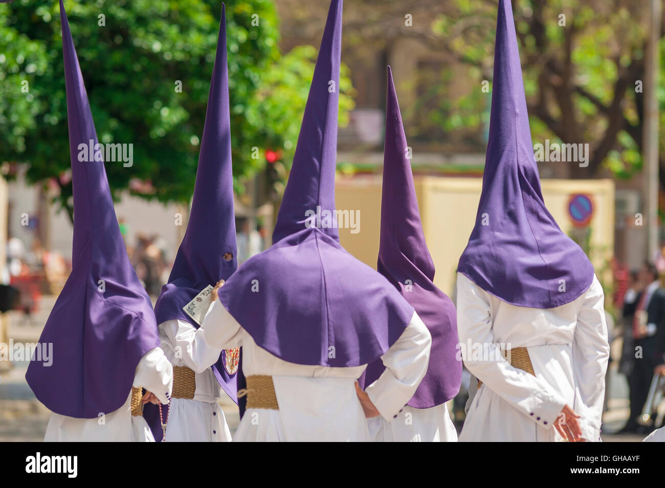 Seville Spain Holy Week, members of a hooded cofradia (brotherhood) gather before a procession in the Semana Santa festival in Seville, Spain. Stock Photo