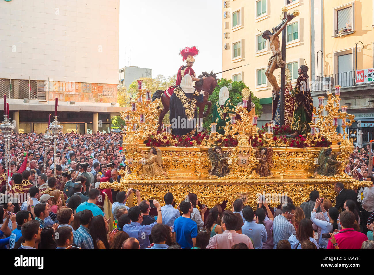 Seville Spain Easter, a huge ornate float bearing a crucifixion scene processes through the streets of Seville in the Semana Santa festival, Spain Stock Photo