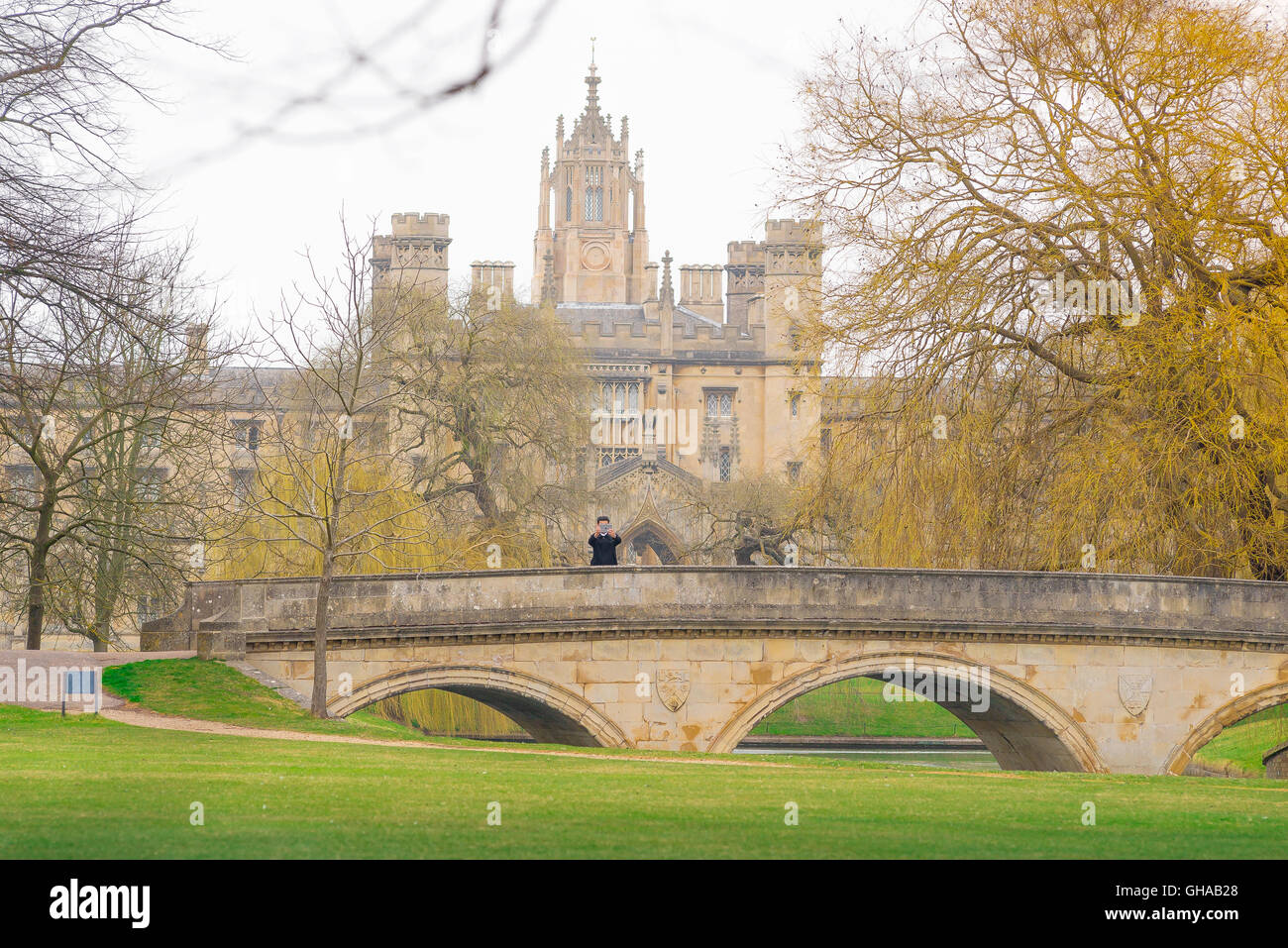A tourist photographs himself on Trinity Bridge against the back-drop of St John's College, Cambridge, UK. Stock Photo