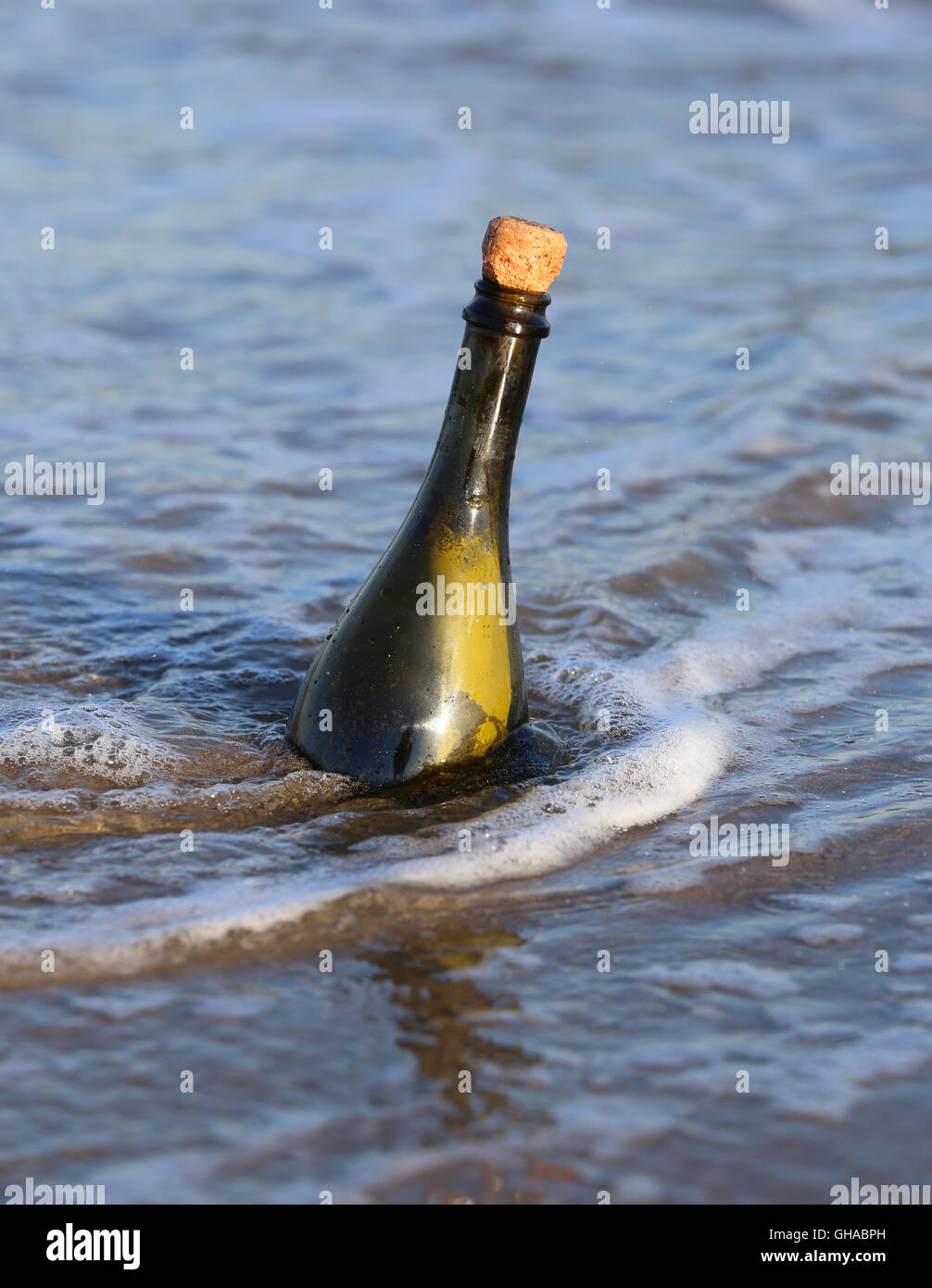 Secret Message in the bottle in the sea Stock Photo - Alamy