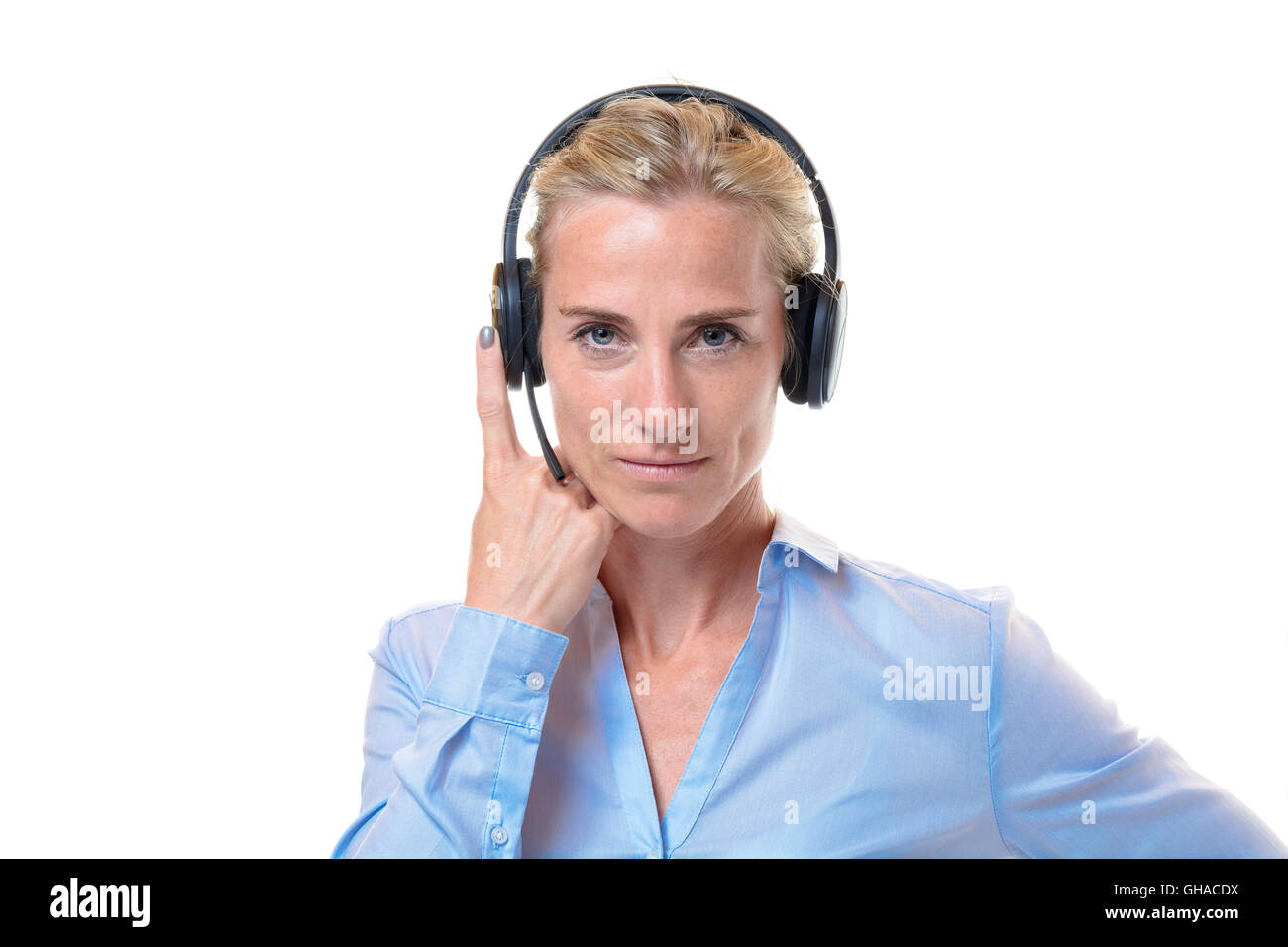 Single short haired blond woman with telephone headset on head