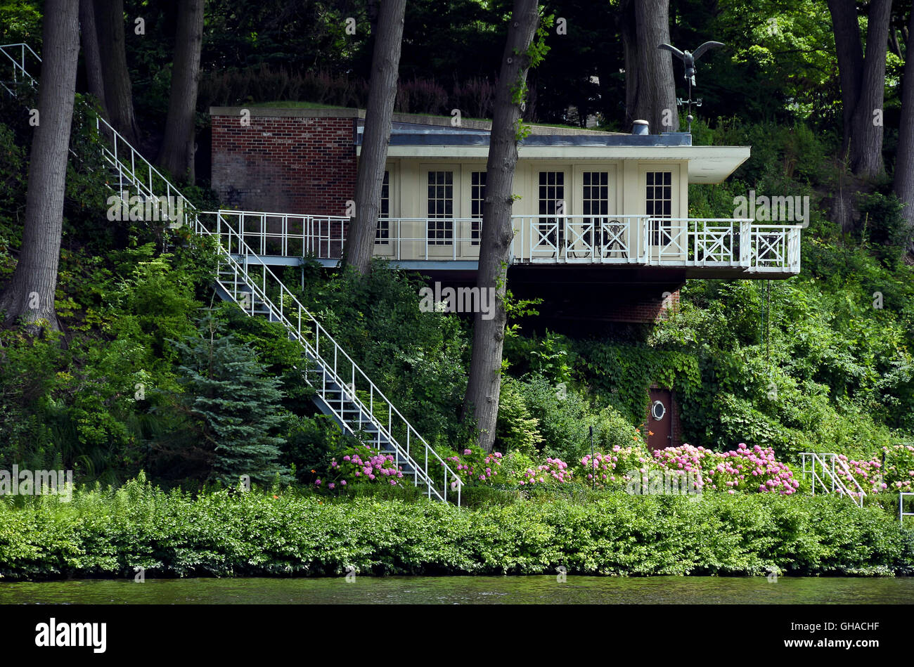 Summer cottage overlooking river with stairway. Stock Photo