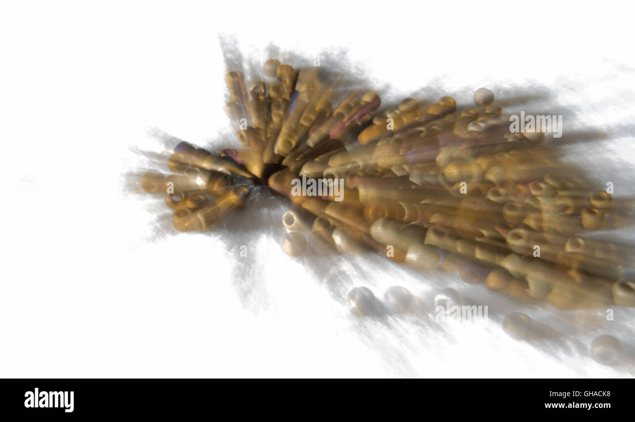 A zoom burr creates a rayed pattern from a stack of multi-colored beads. Stock Photo