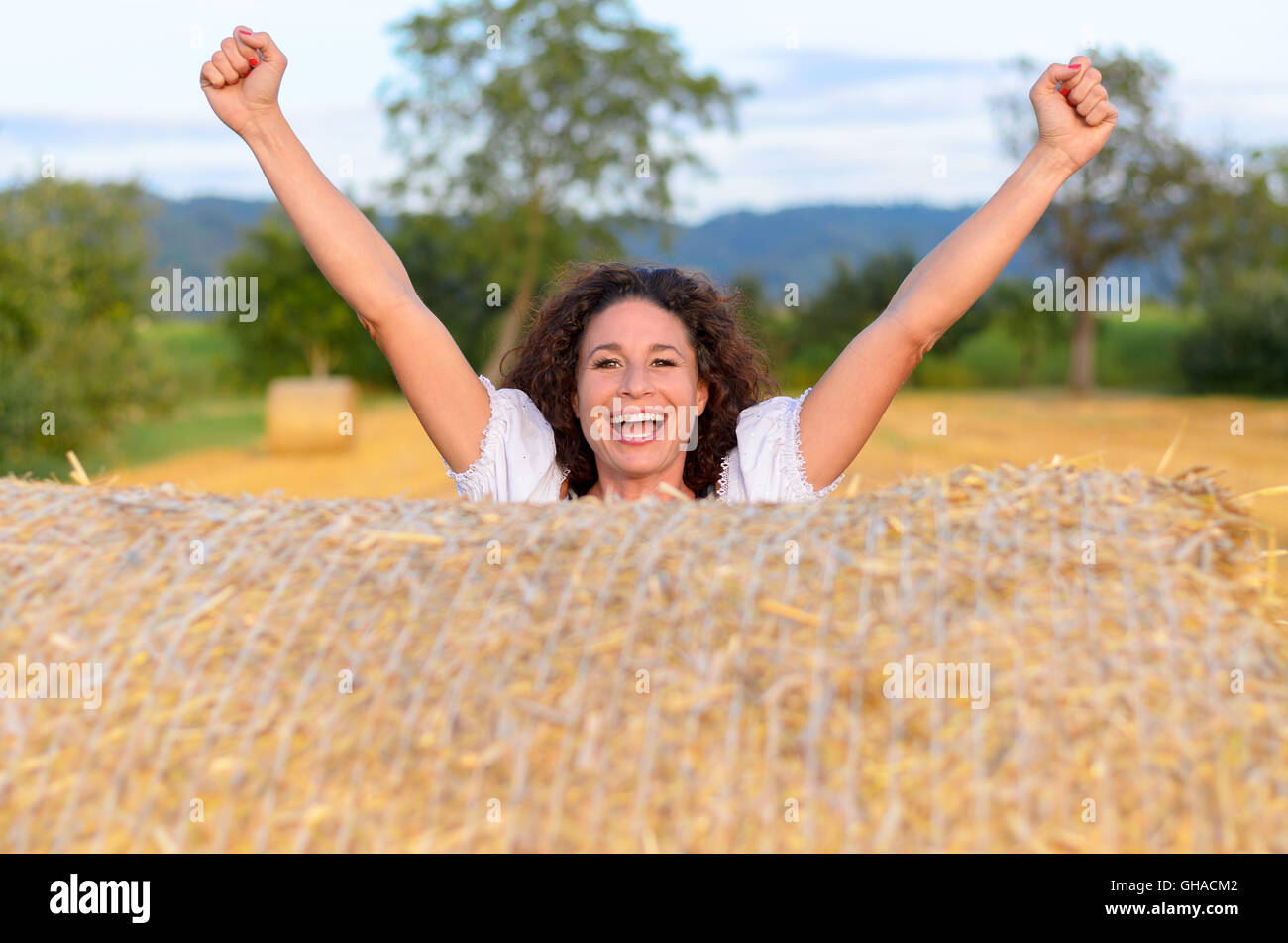 Excited young woman cheering hi-res stock photography and images - Alamy