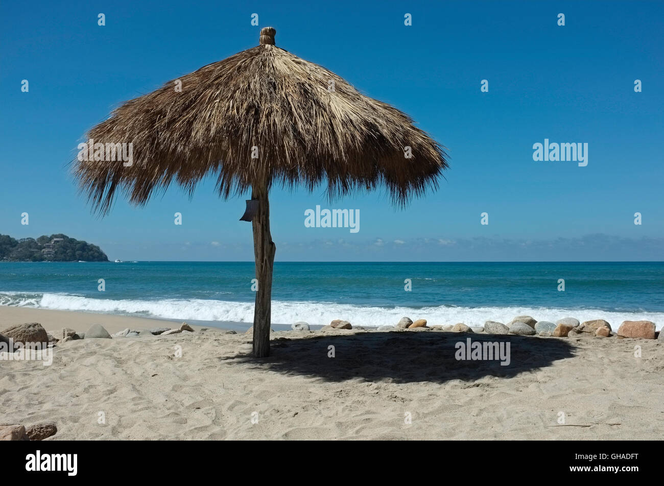 A palapa sun shade on the beach at Sayulita, Riviera Nayarit, Mexico. Stock Photo