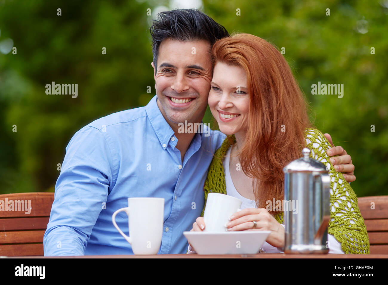 Couple relaxing outdoors Stock Photo - Alamy
