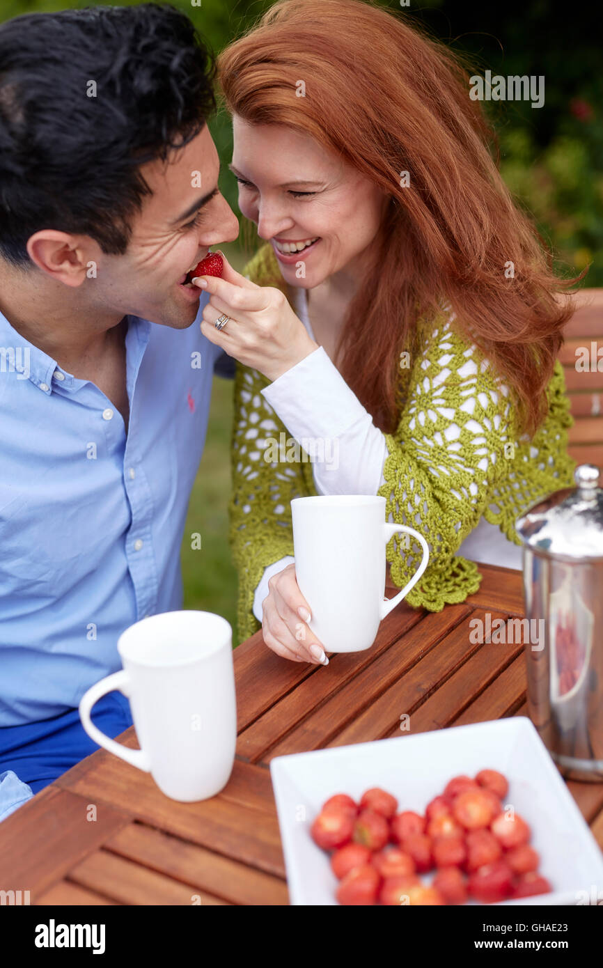 Couple relaxing outdoors Stock Photo