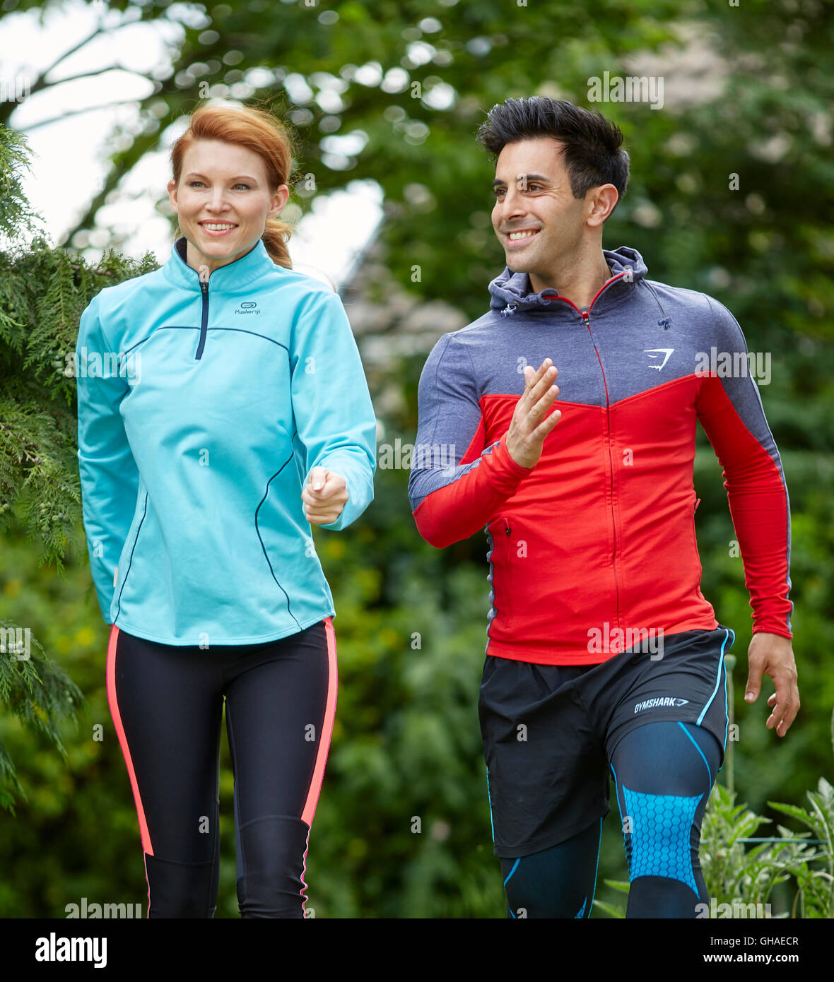 Couple stretching warming up together Stock Photo