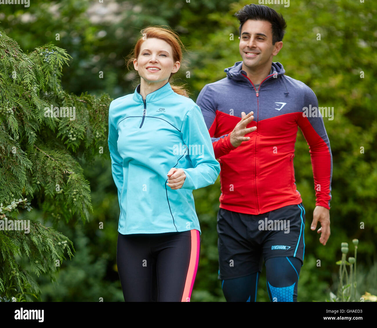 Couple stretching warming up together Stock Photo