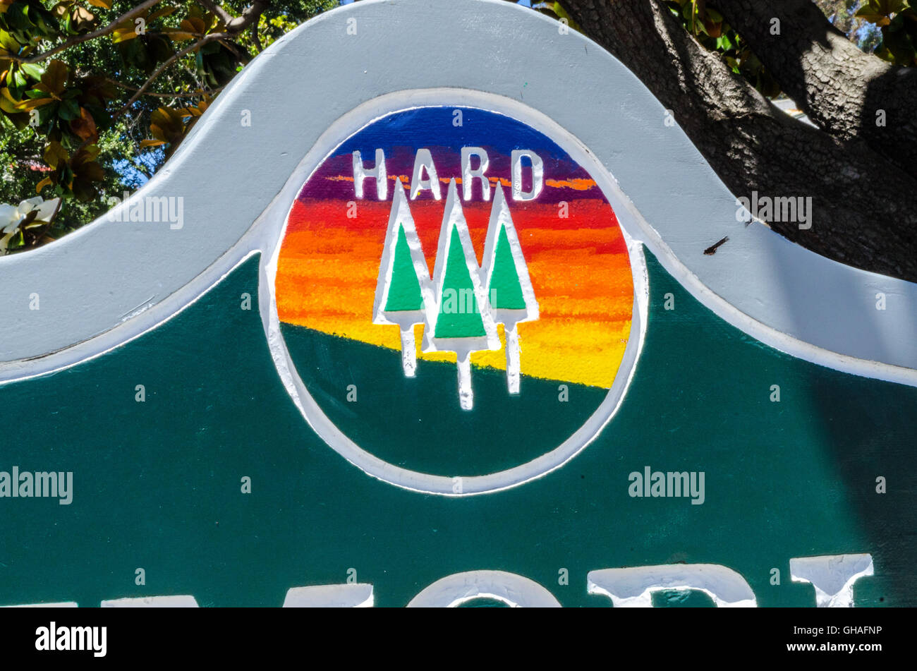 Sign for H.A.R.D. - Hayward Area Recreation District with it's colorful logo of 3 trees on a hillside in foreground to a multi-h Stock Photo
