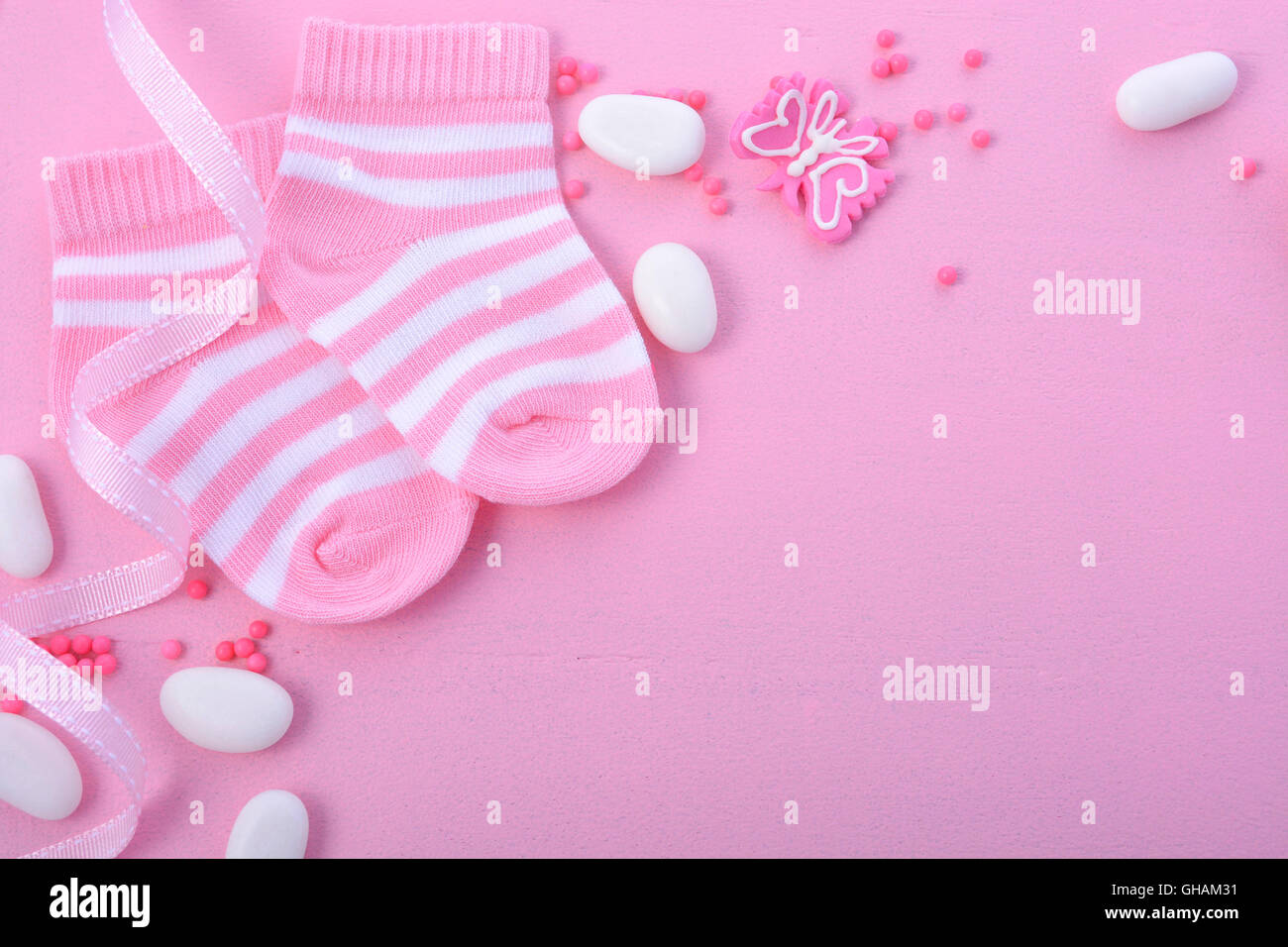 Its a Girl pink theme Baby Shower or Nursery background with decorated  borders on pink wood background Stock Photo - Alamy