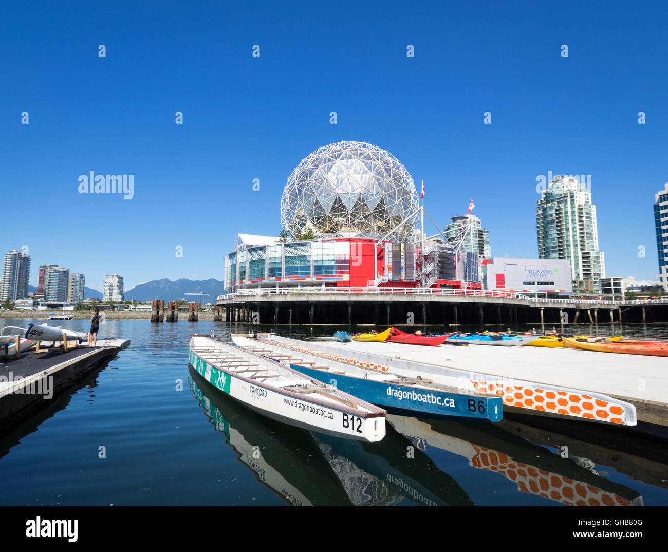 View of Science World at Telus World of Science and the Dragon Zone Paddling Club on False Creek in Vancouver, British Columbia, Canada. Stock Photo