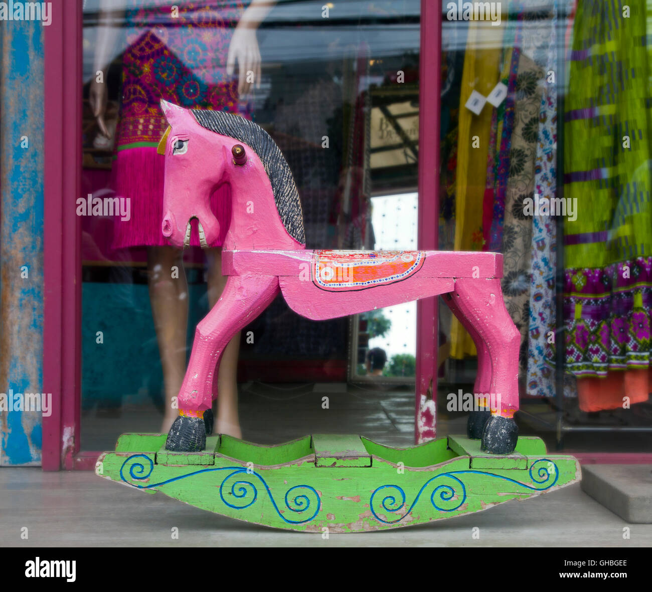old Pink wooden rocking horse Stock Photo - Alamy
