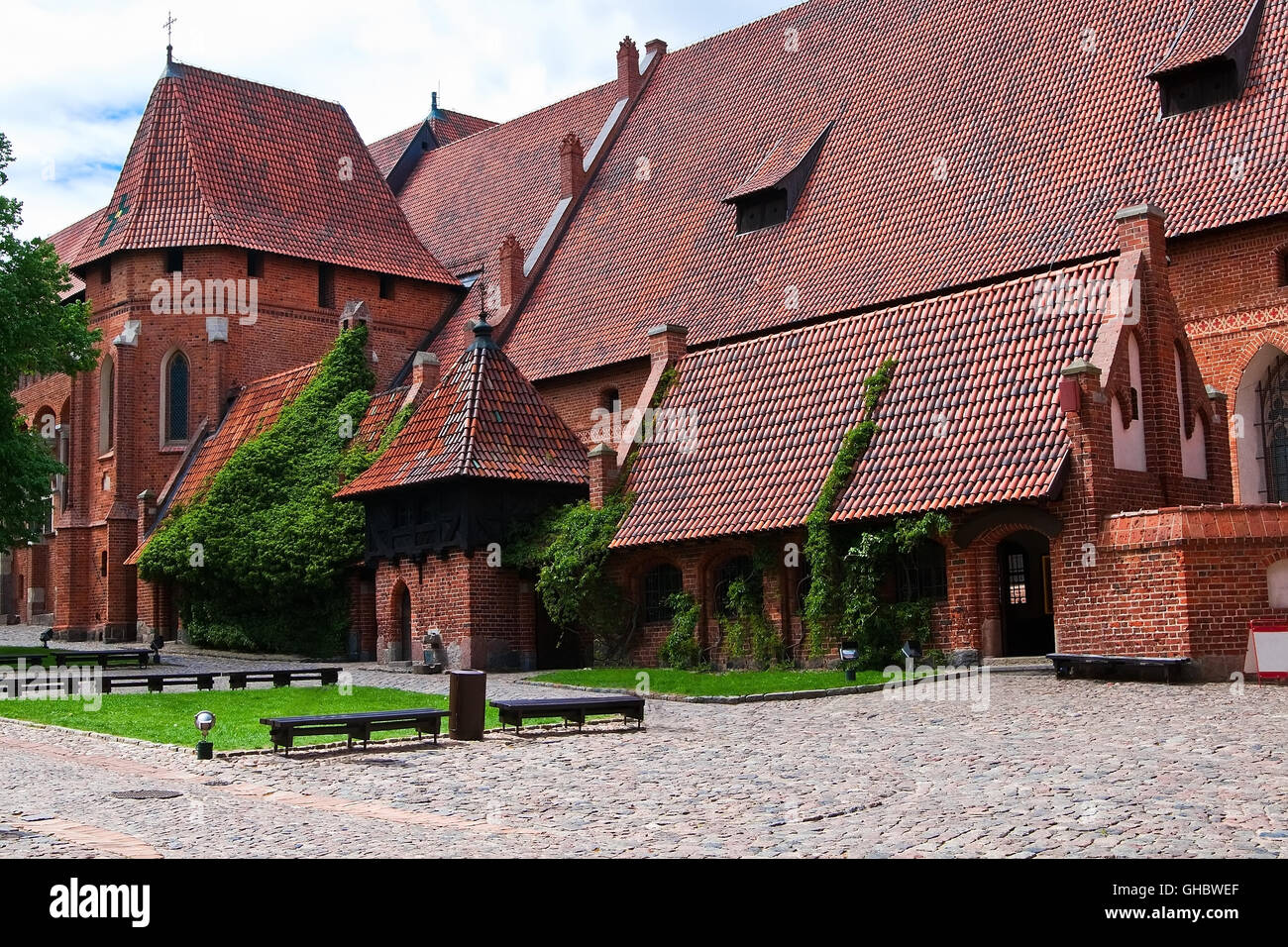 Malbork castle courtyard. Large refectory and the palace chapel of St Catherine. Poland Stock Photo